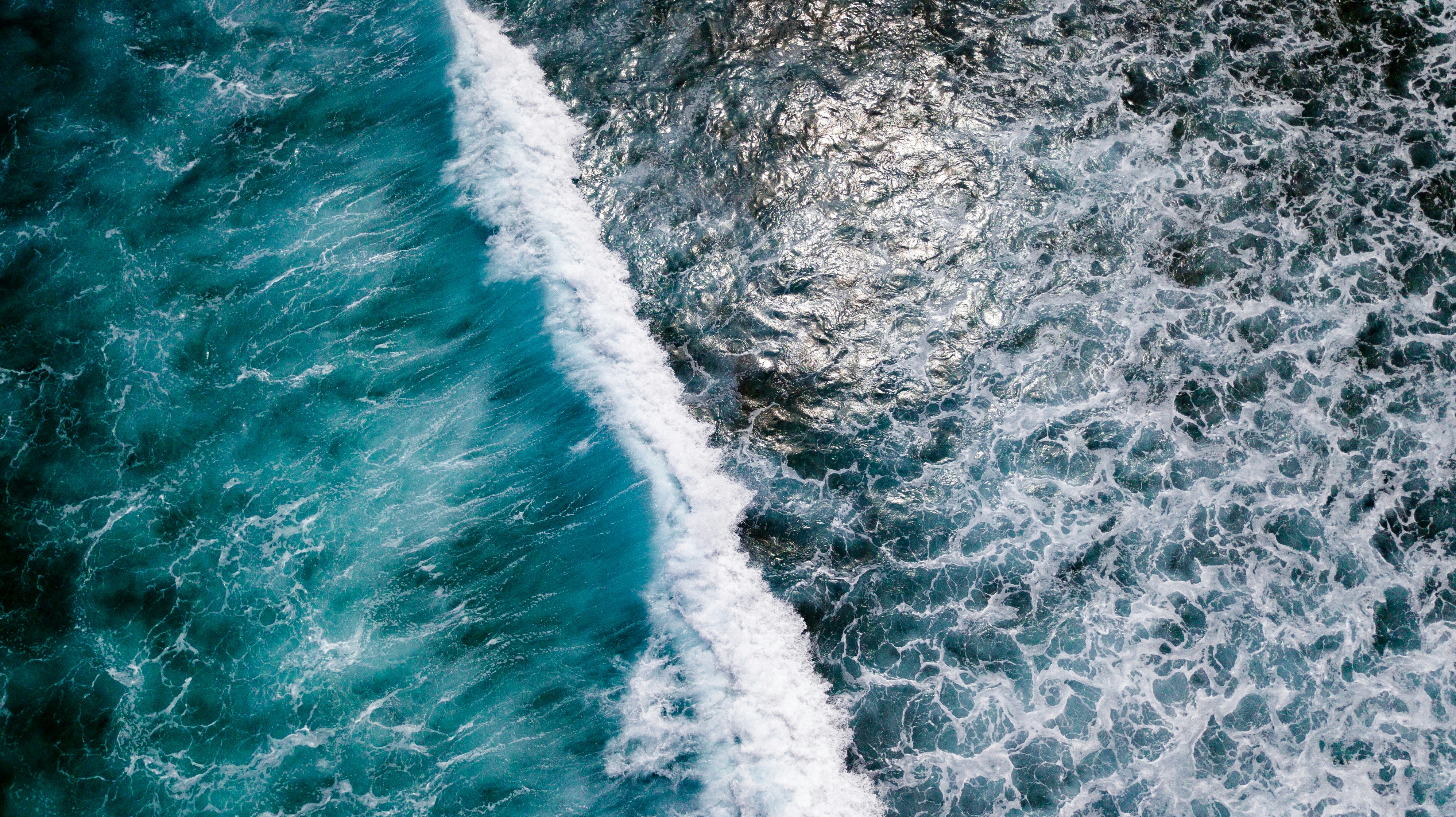 Aerial View of Breaking Ocean Wave