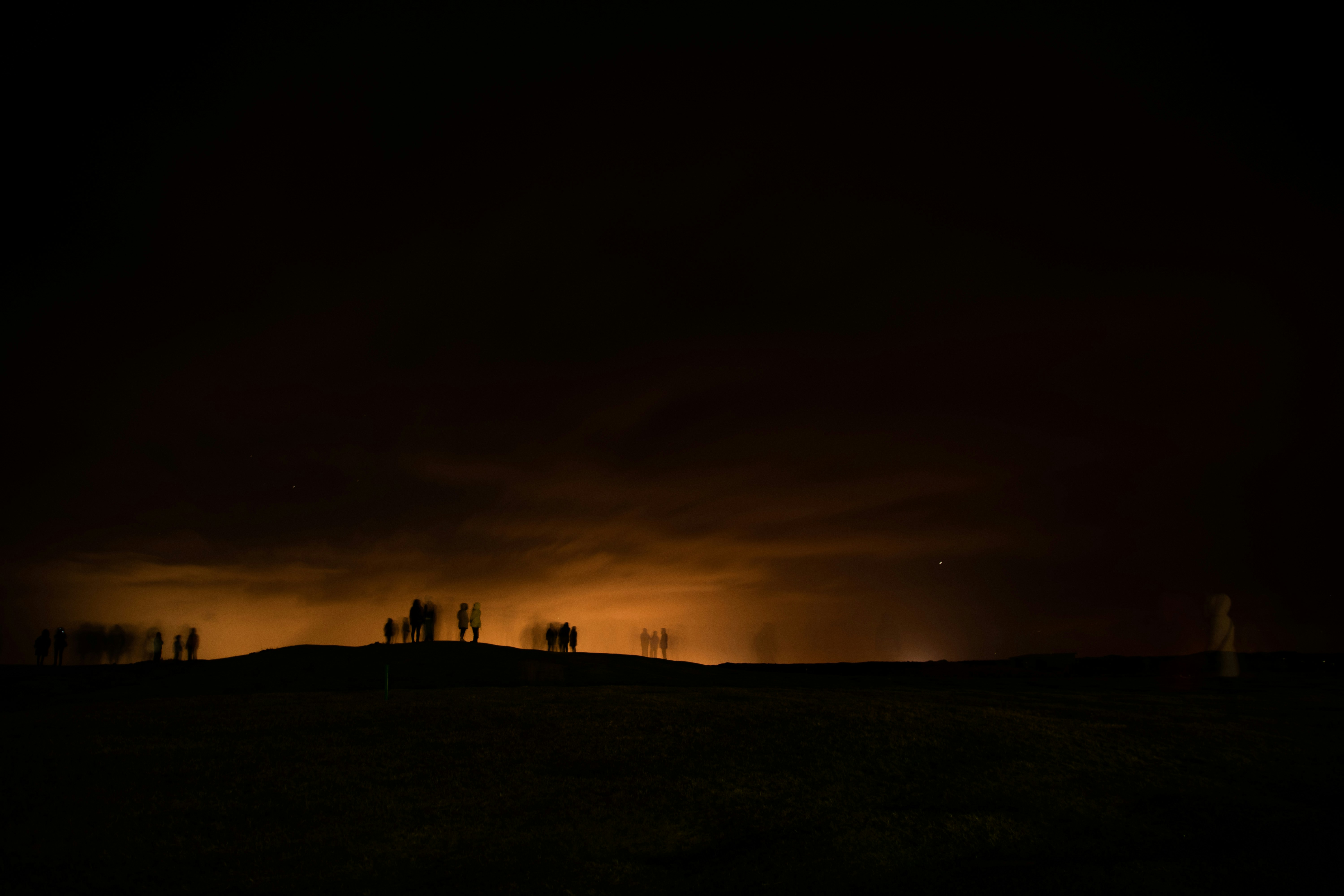 Hilltop People Silhouettes at Night
