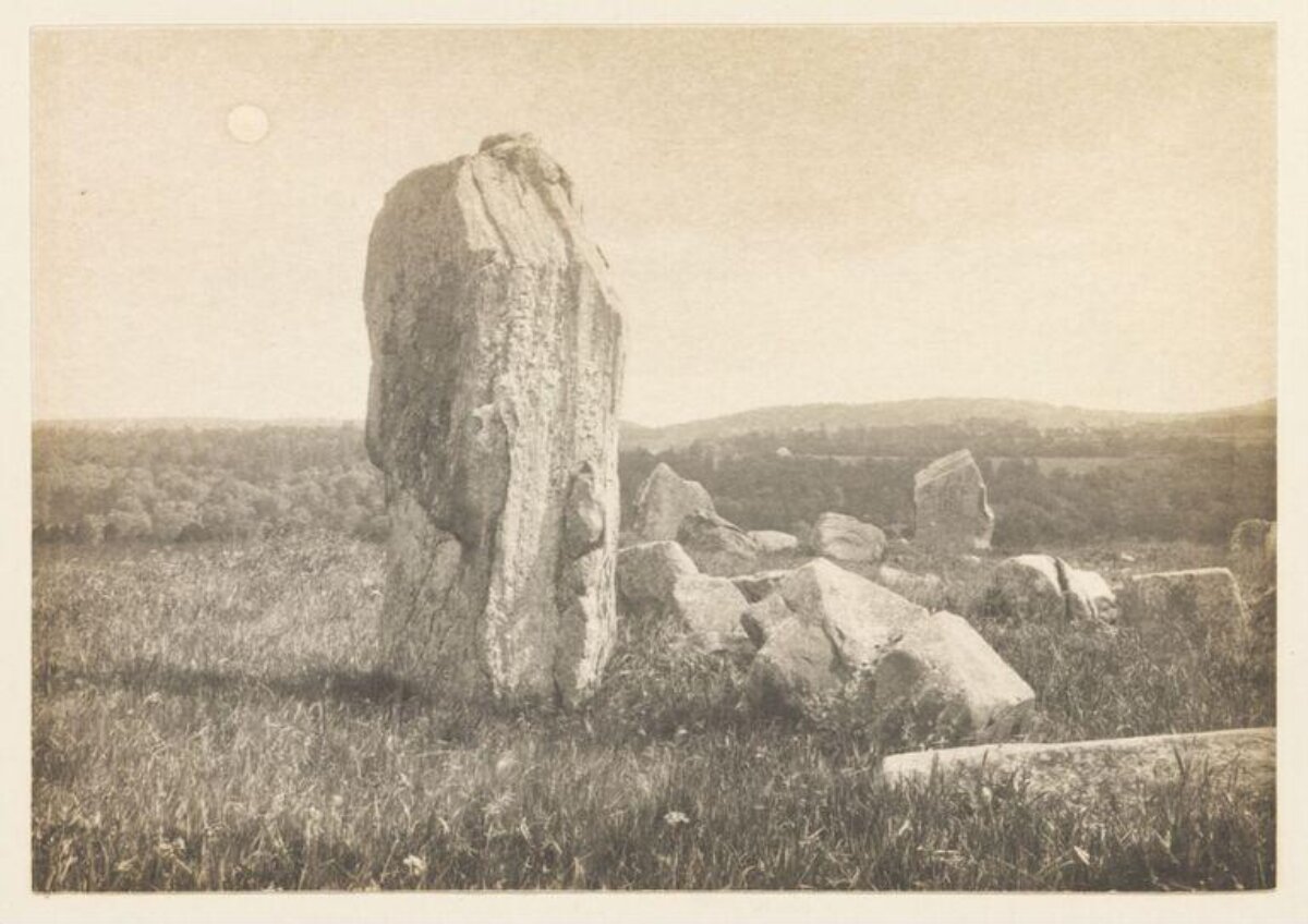 Ancient Standing Stones in Grass Field