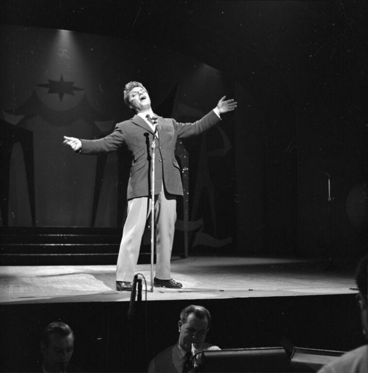 Male Singer Performing on Stage