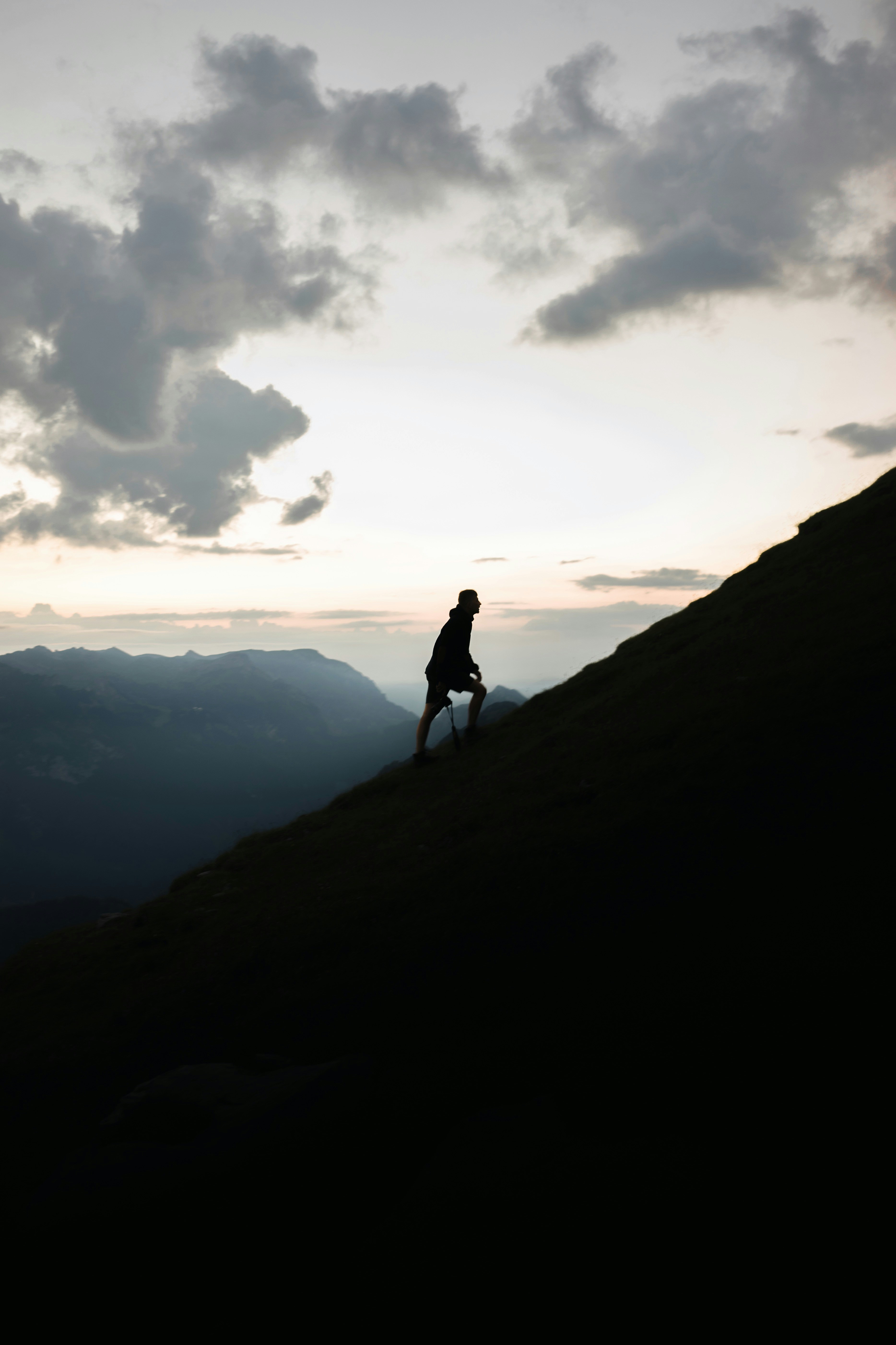 Hiker Climbing Mountain Slope