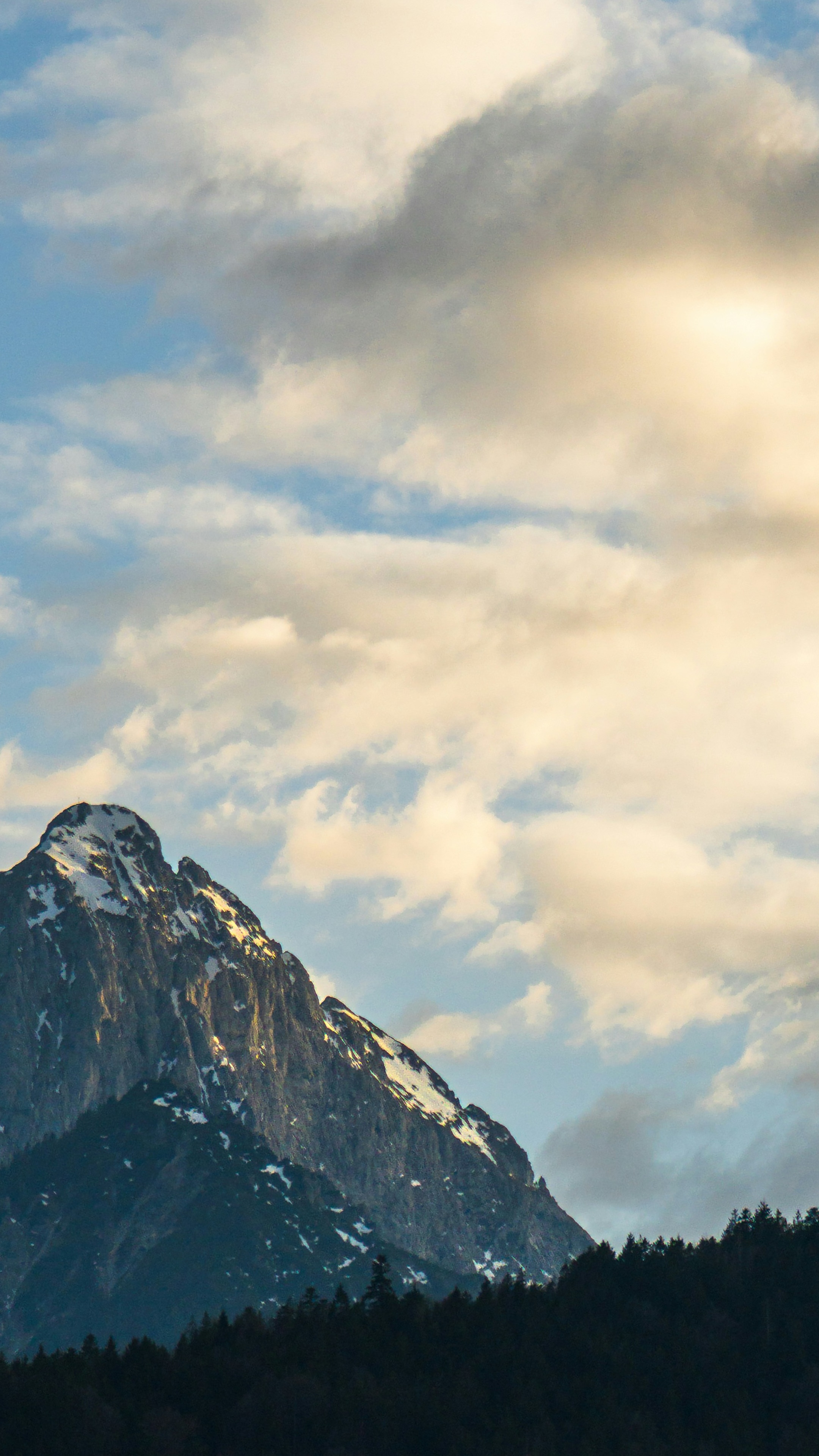 Snow Capped Mountain Under Cloudy Sky