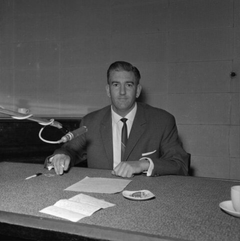 Broadcaster at Radio Studio Desk