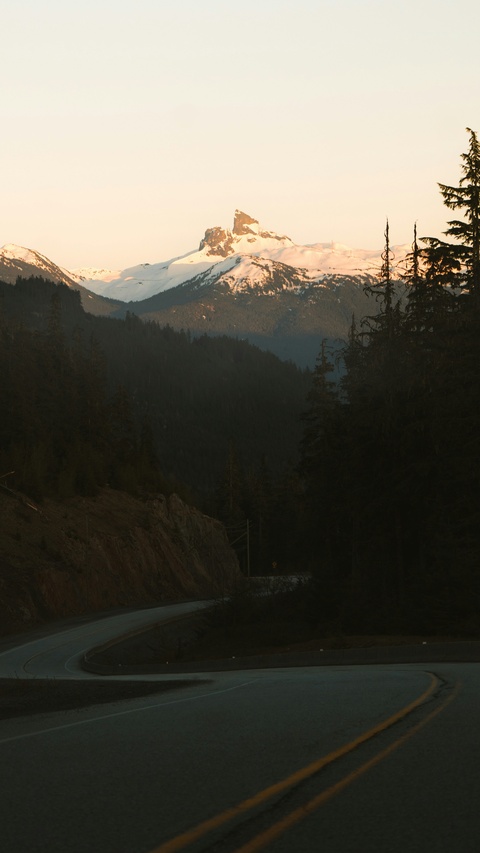Winding Road to Snow-Capped Mountain