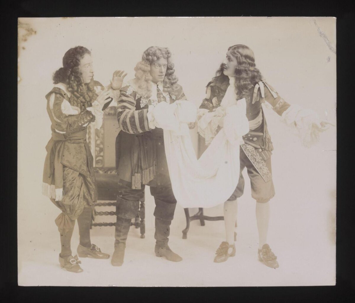Three Actors in Period Stage Costumes