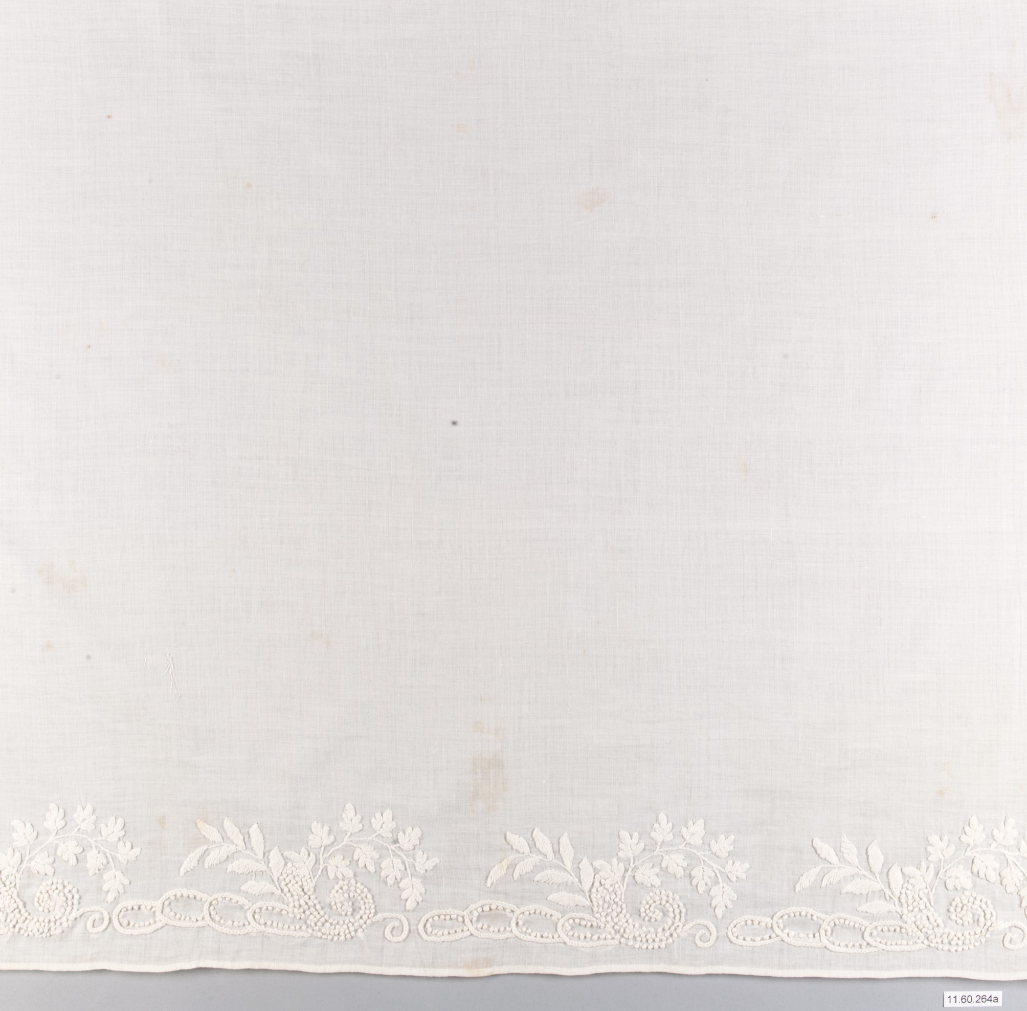 White Embroidered Textile Border