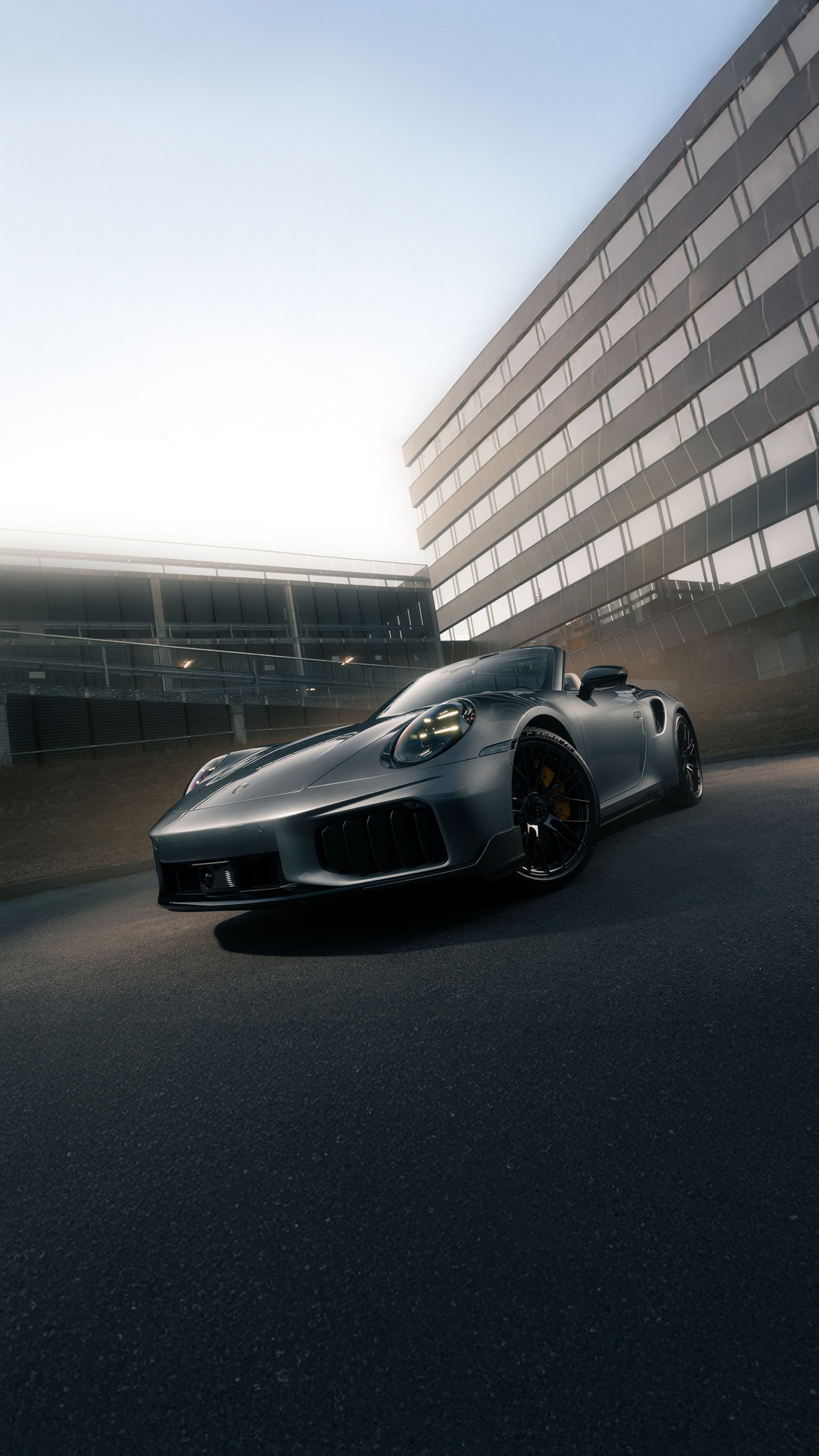 Grey Porsche Convertible by Modern Office Building