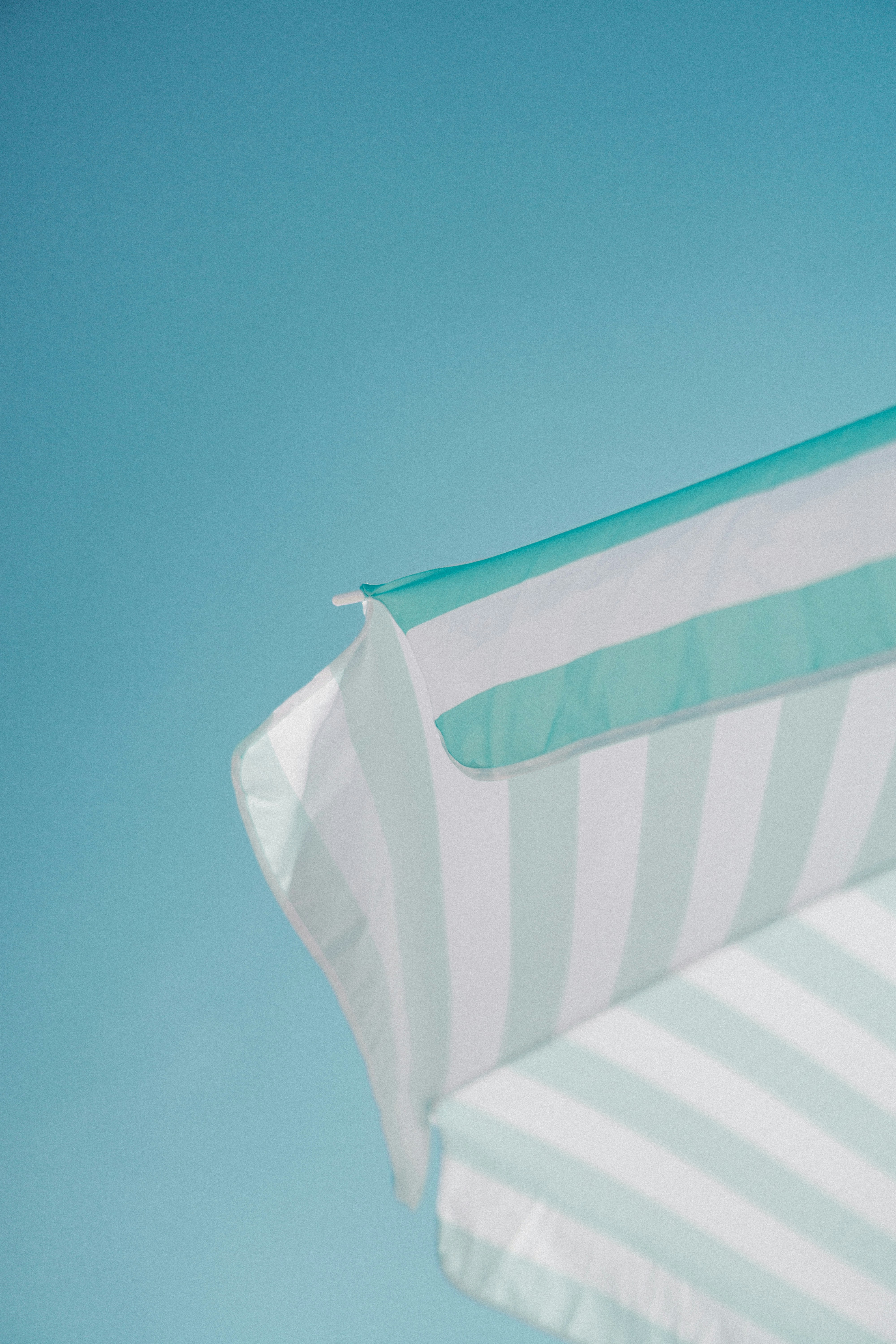 Striped Awning Under Clear Blue Sky