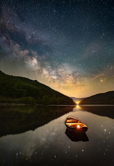 Milky Way Over Calm Lake With Boat
