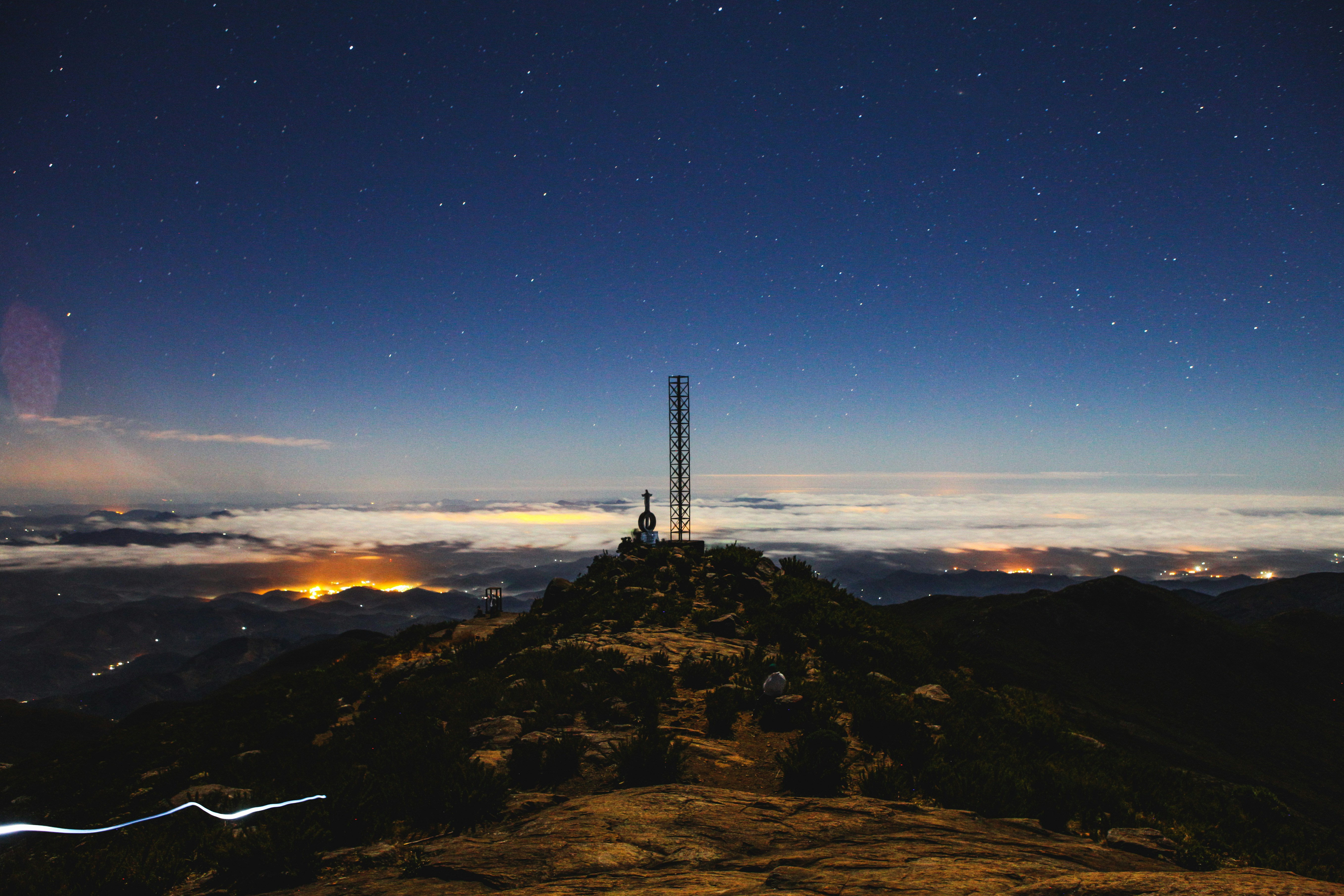 Starry Night on Mountain Peak Above Cloud Sea
