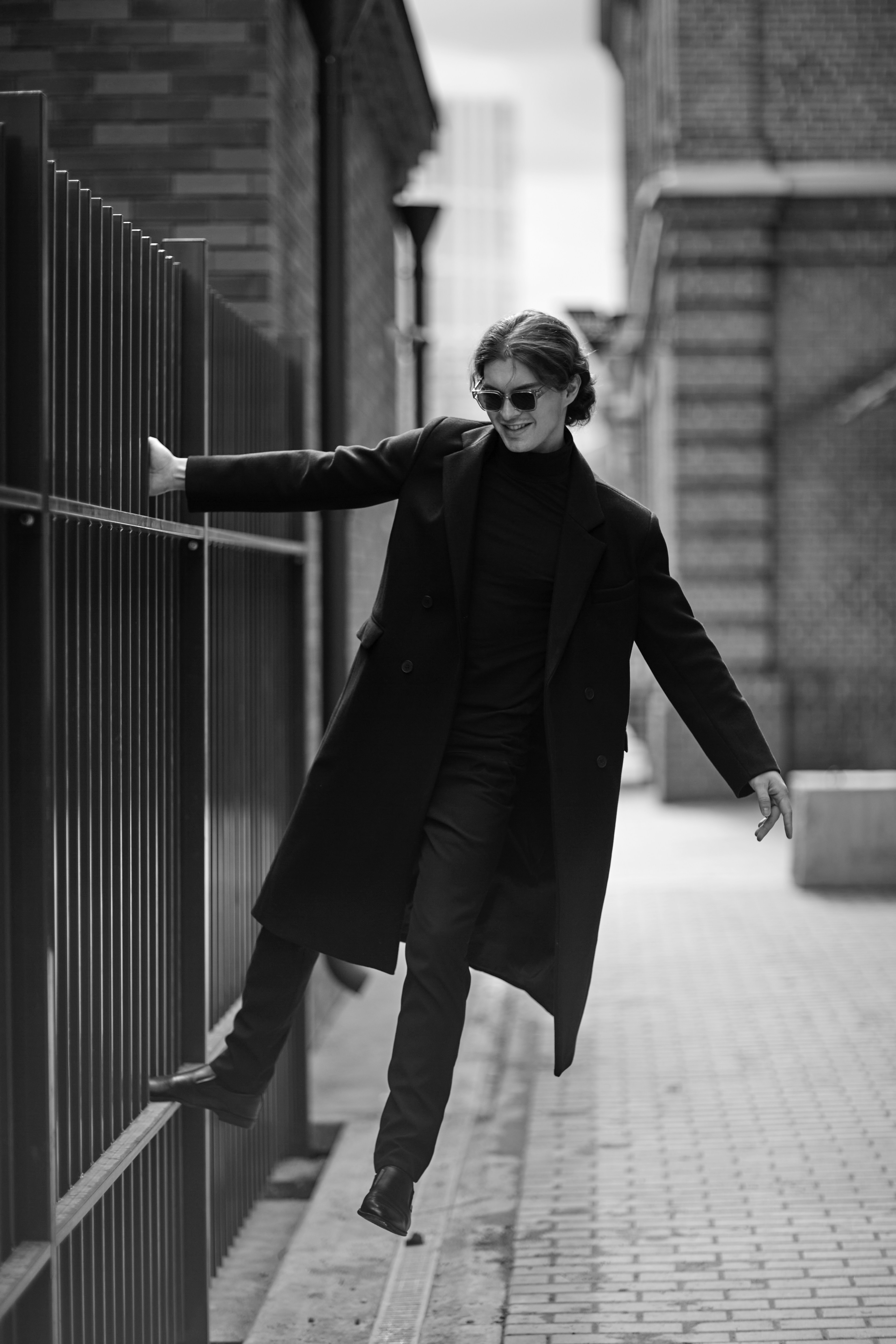 Stylish Man Posing in Urban Alley
