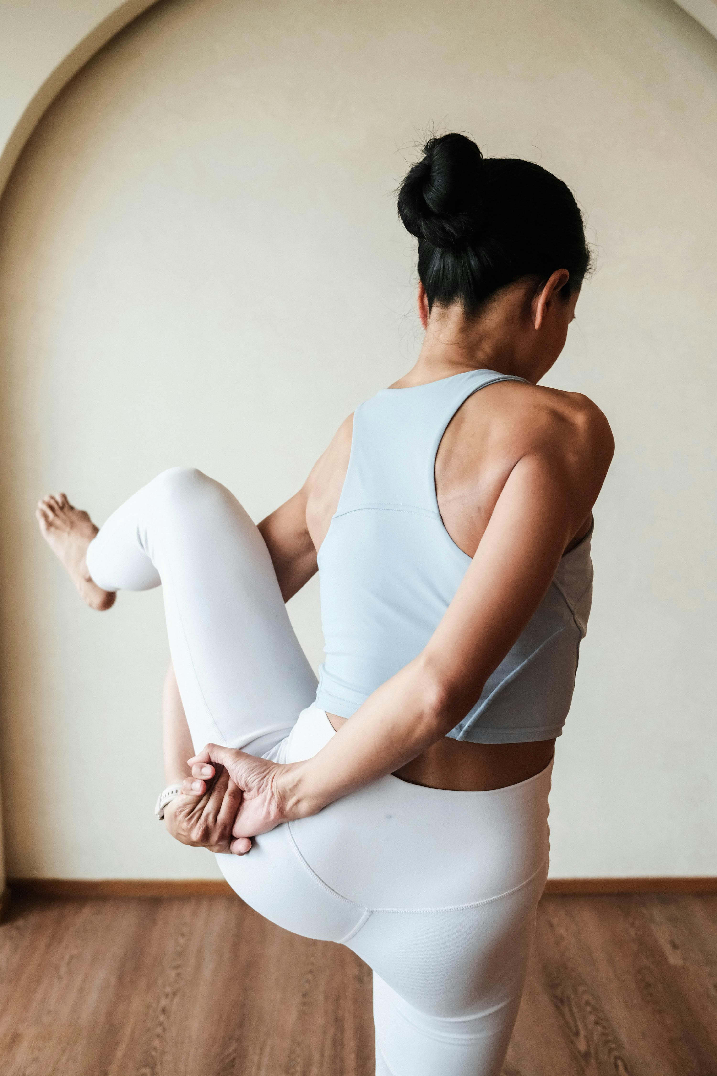 Woman Practicing Advanced Yoga Pose