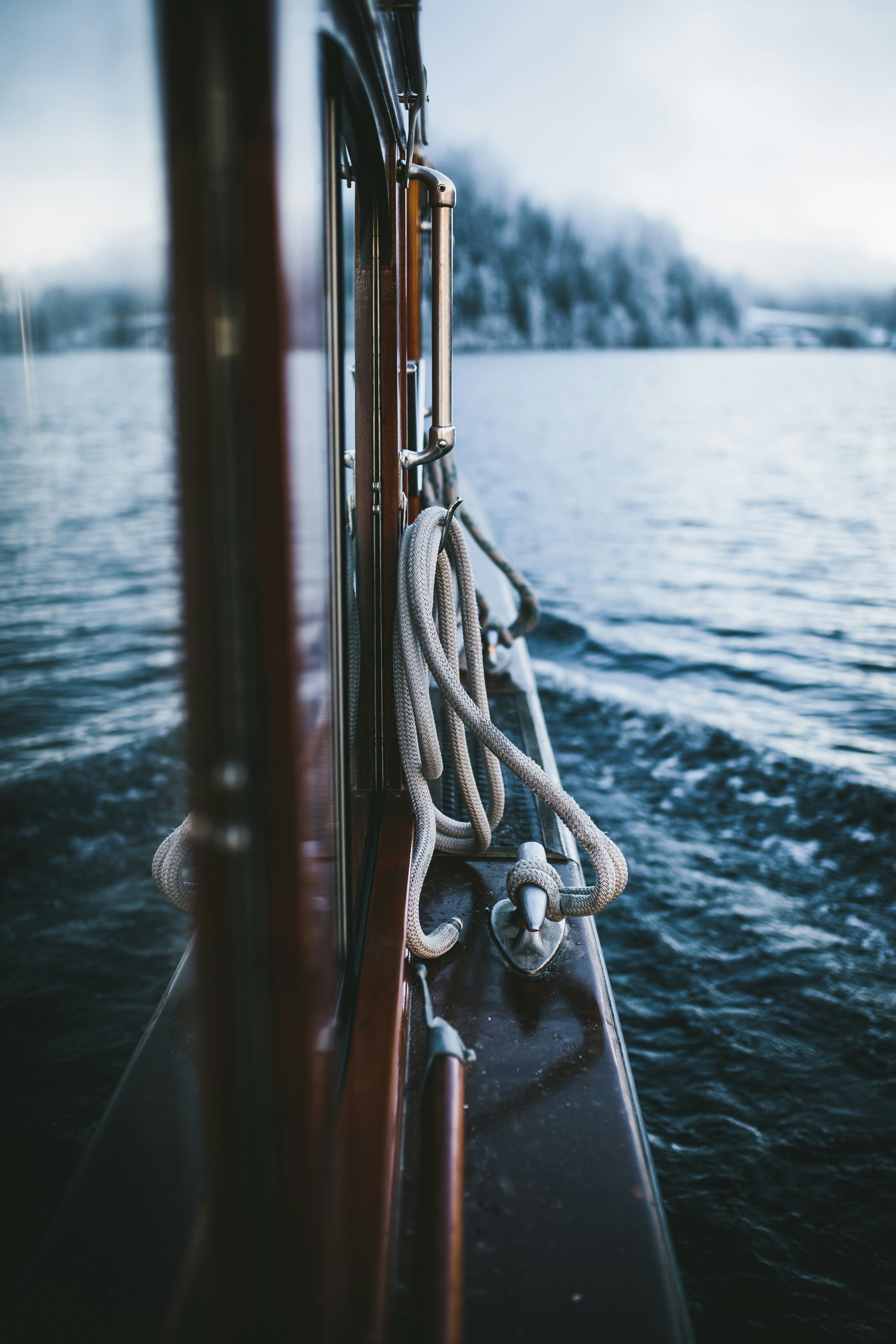 Wooden Boat Sailing on Misty Lake
