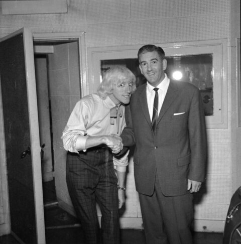 Two Men Shaking Hands In Studio