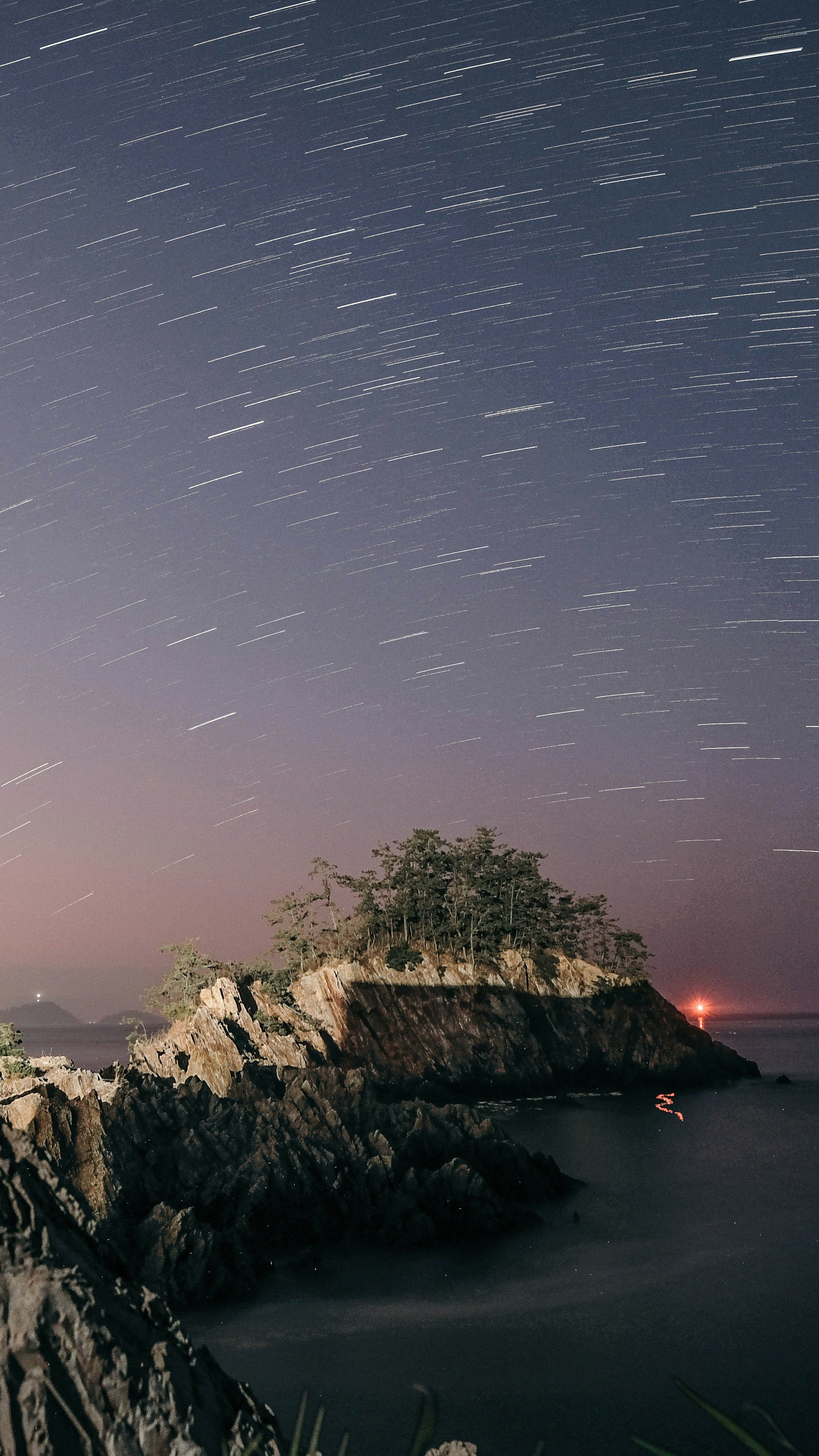Star Trails Over Coastal Rocky Island