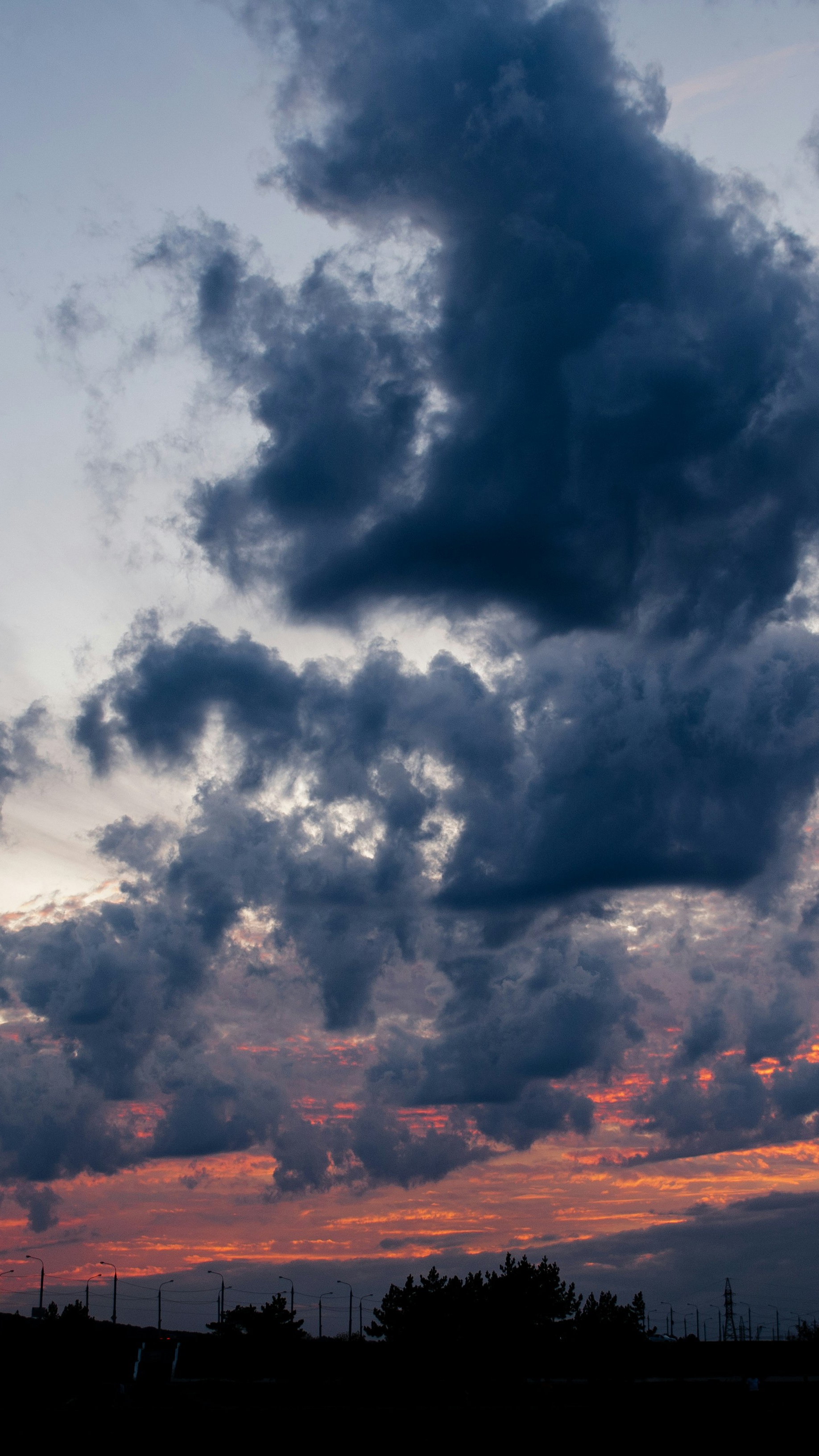 Stormy Clouds Over Sunset Horizon