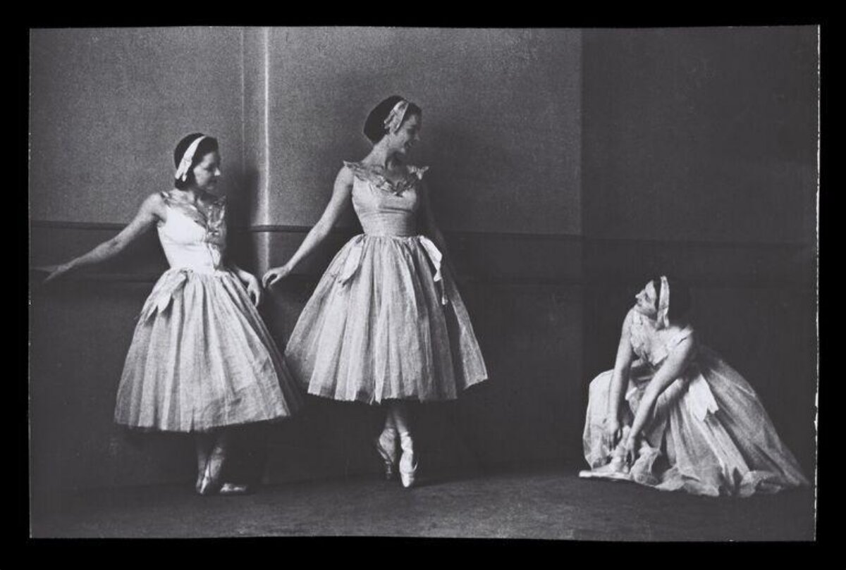 Three Ballerinas Preparing Backstage