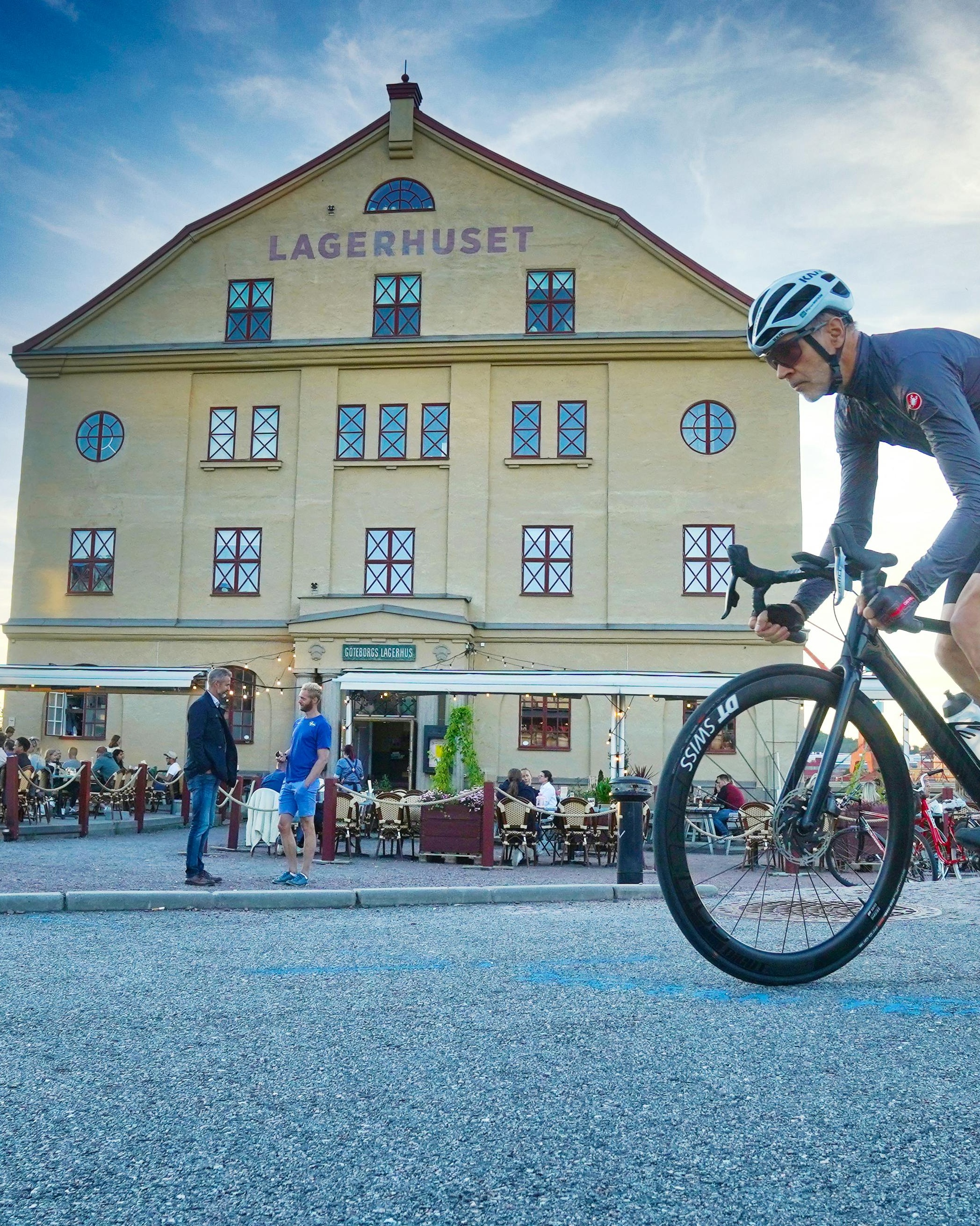 Cyclist Riding Past Lagerhuset Building