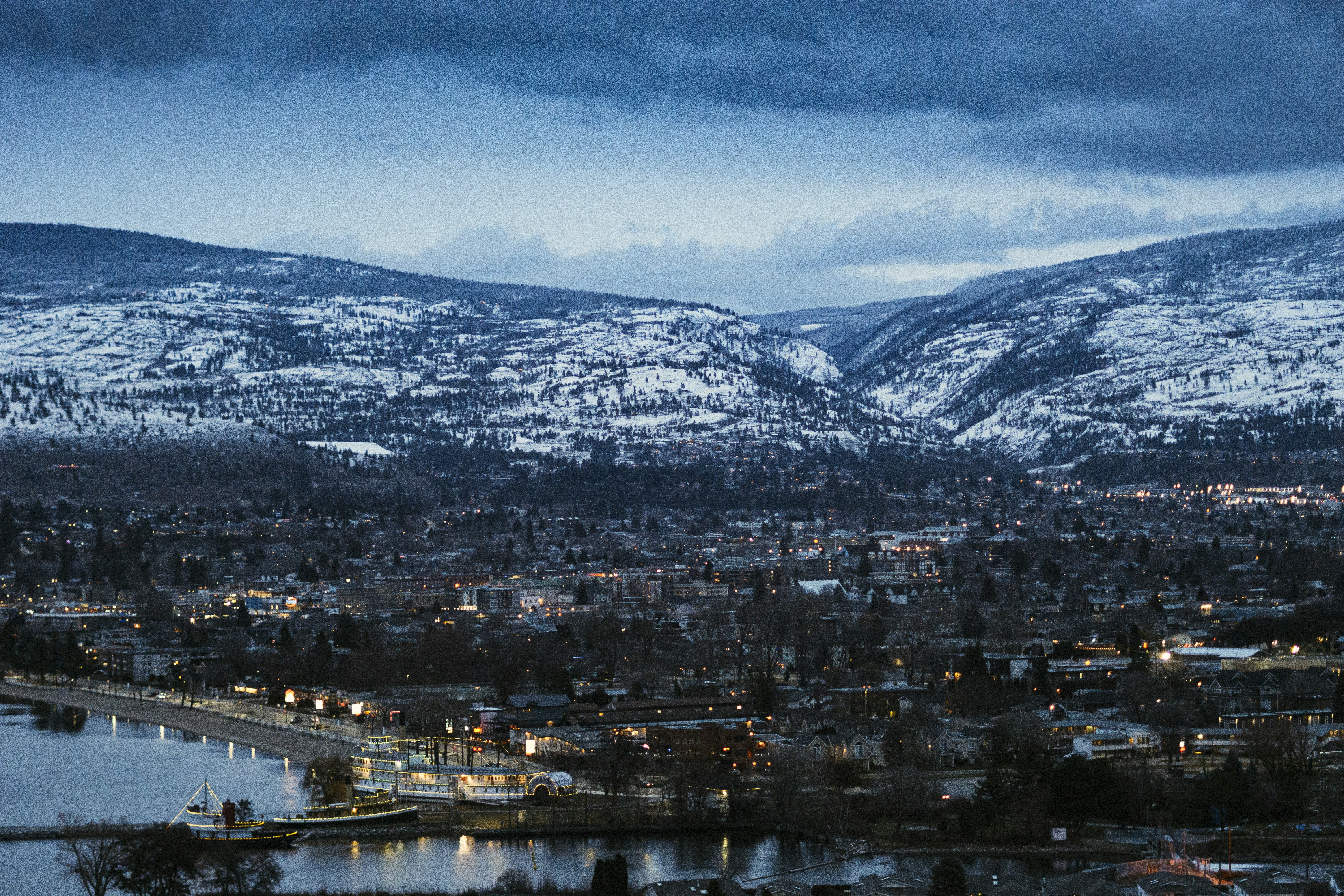 Dusk View of Lakeside Town and Snow Mountains