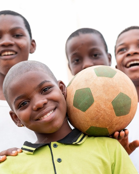 Smiling Boys with a Soccer Ball