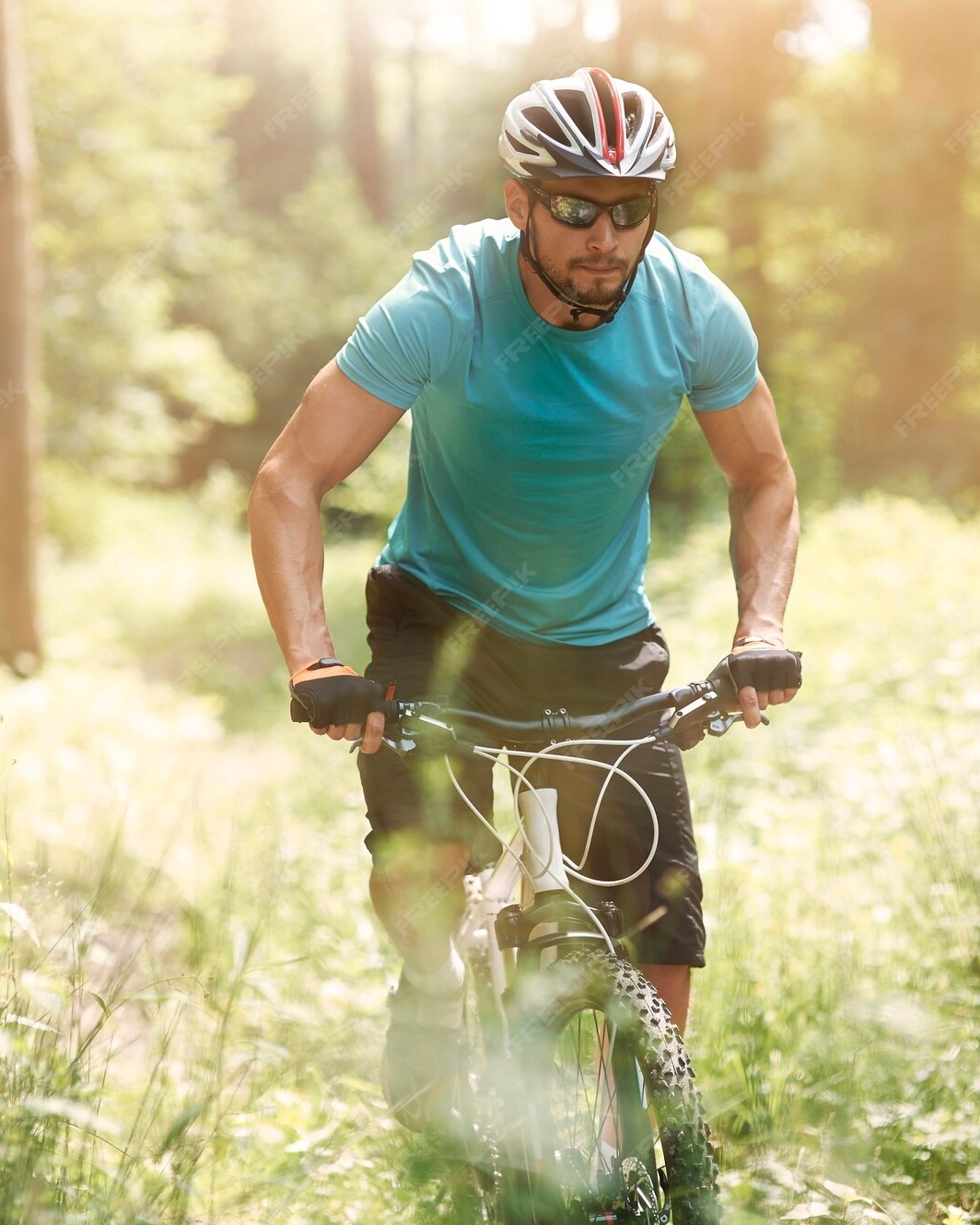 Man Mountain Biking In Forest