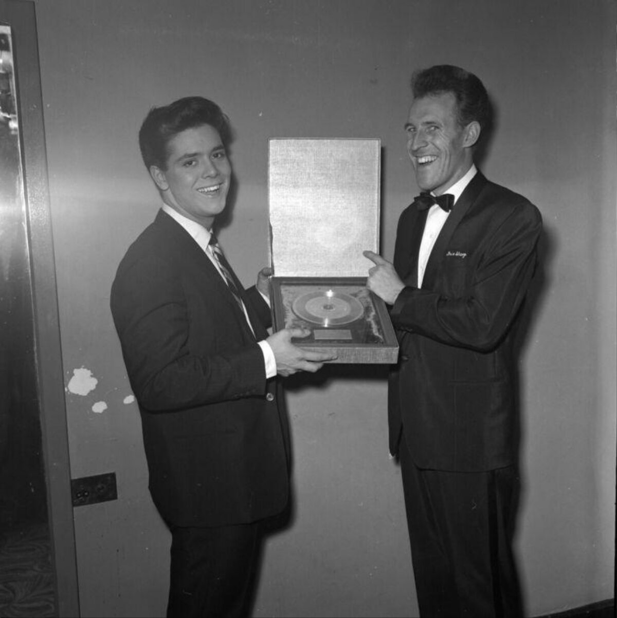 Two Men Presenting Gold Disc Award