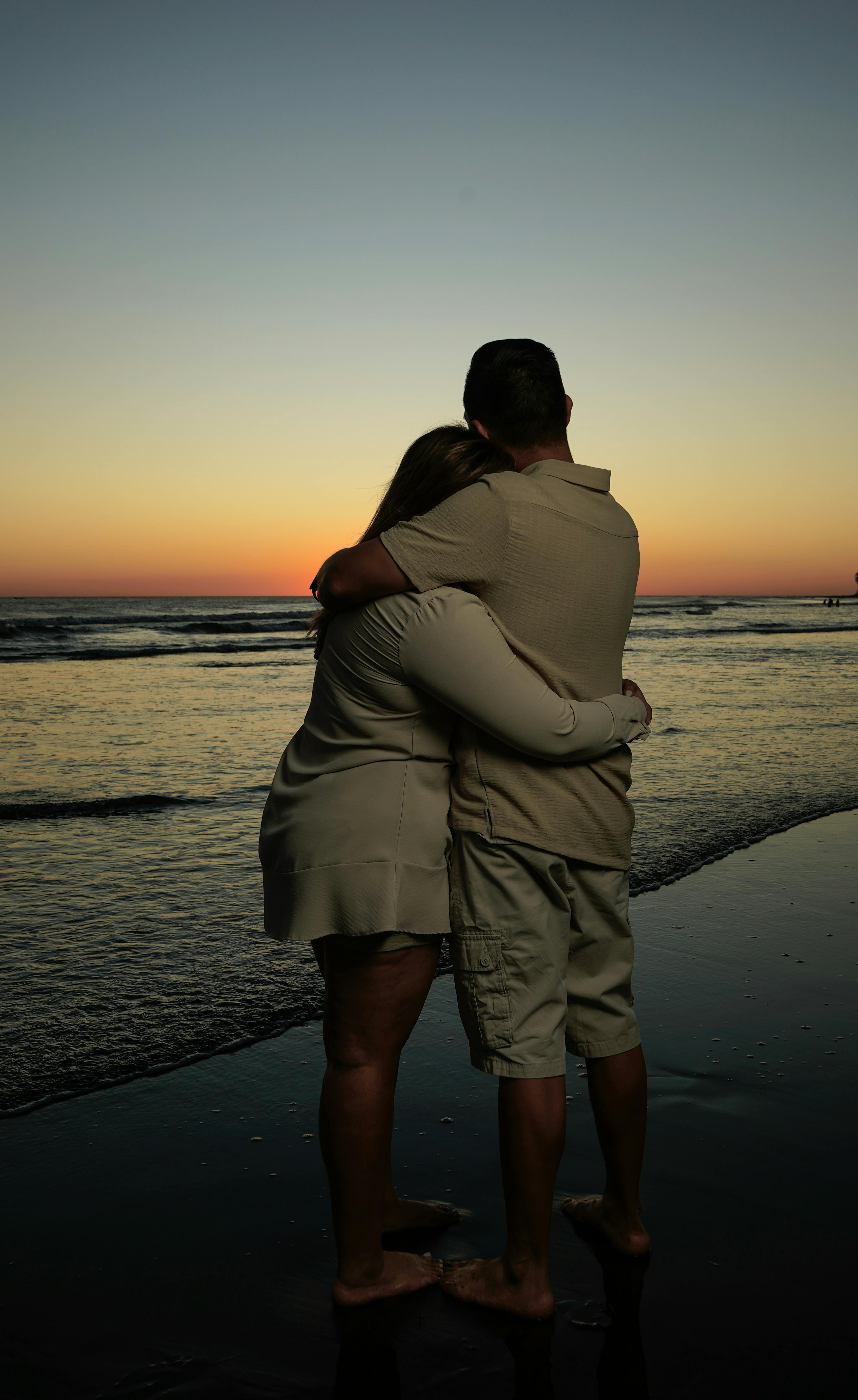 Couple Hugging At Beach Sunset