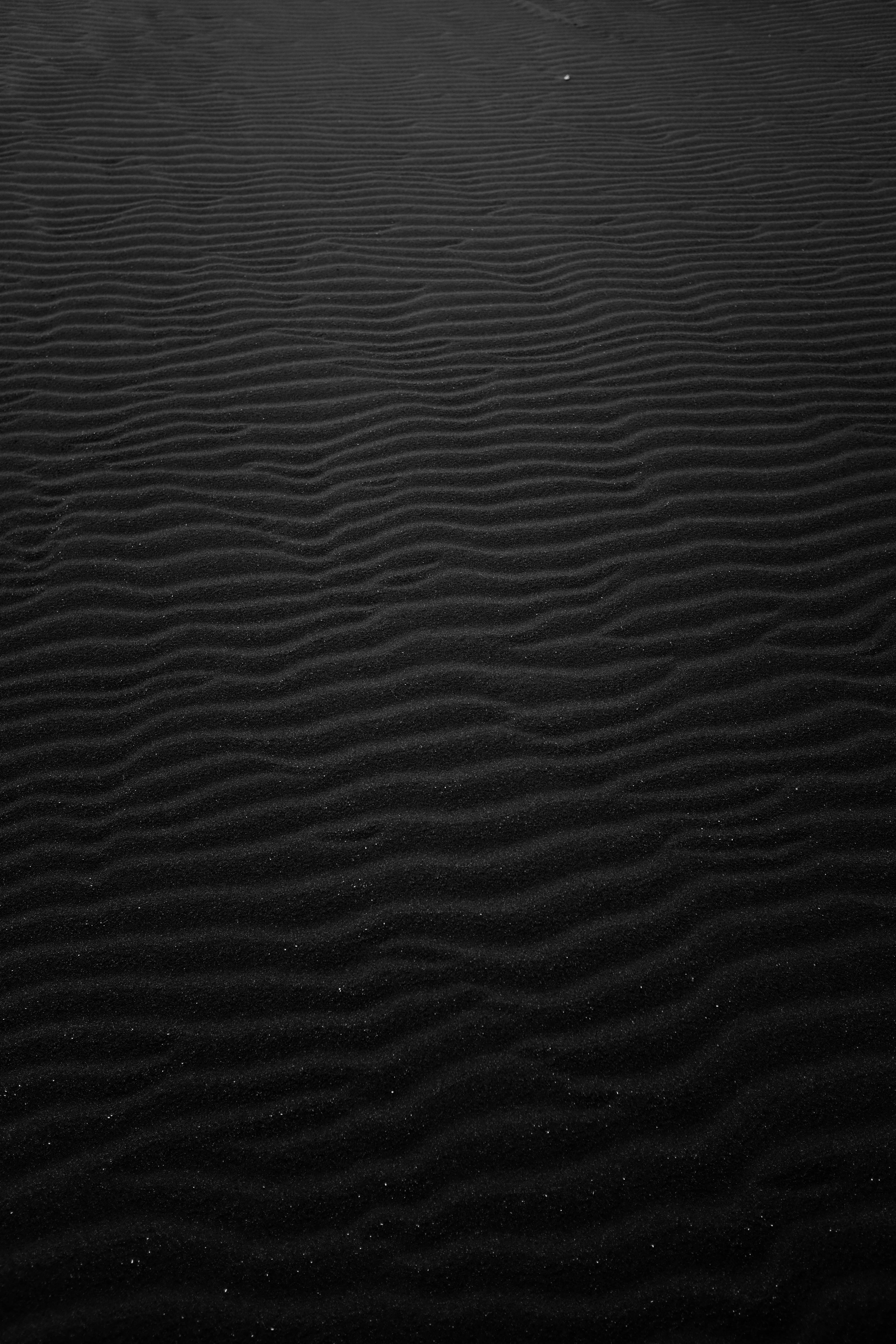 Black Rippled Sand Surface