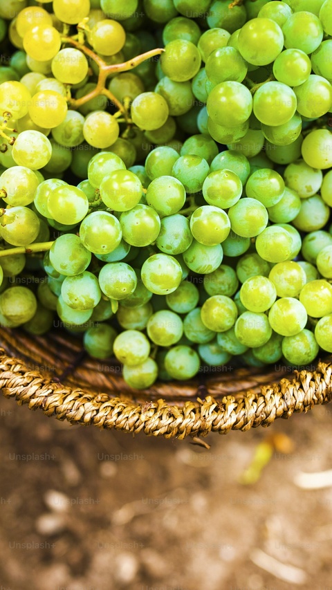 Fresh Green Grapes in Woven Basket