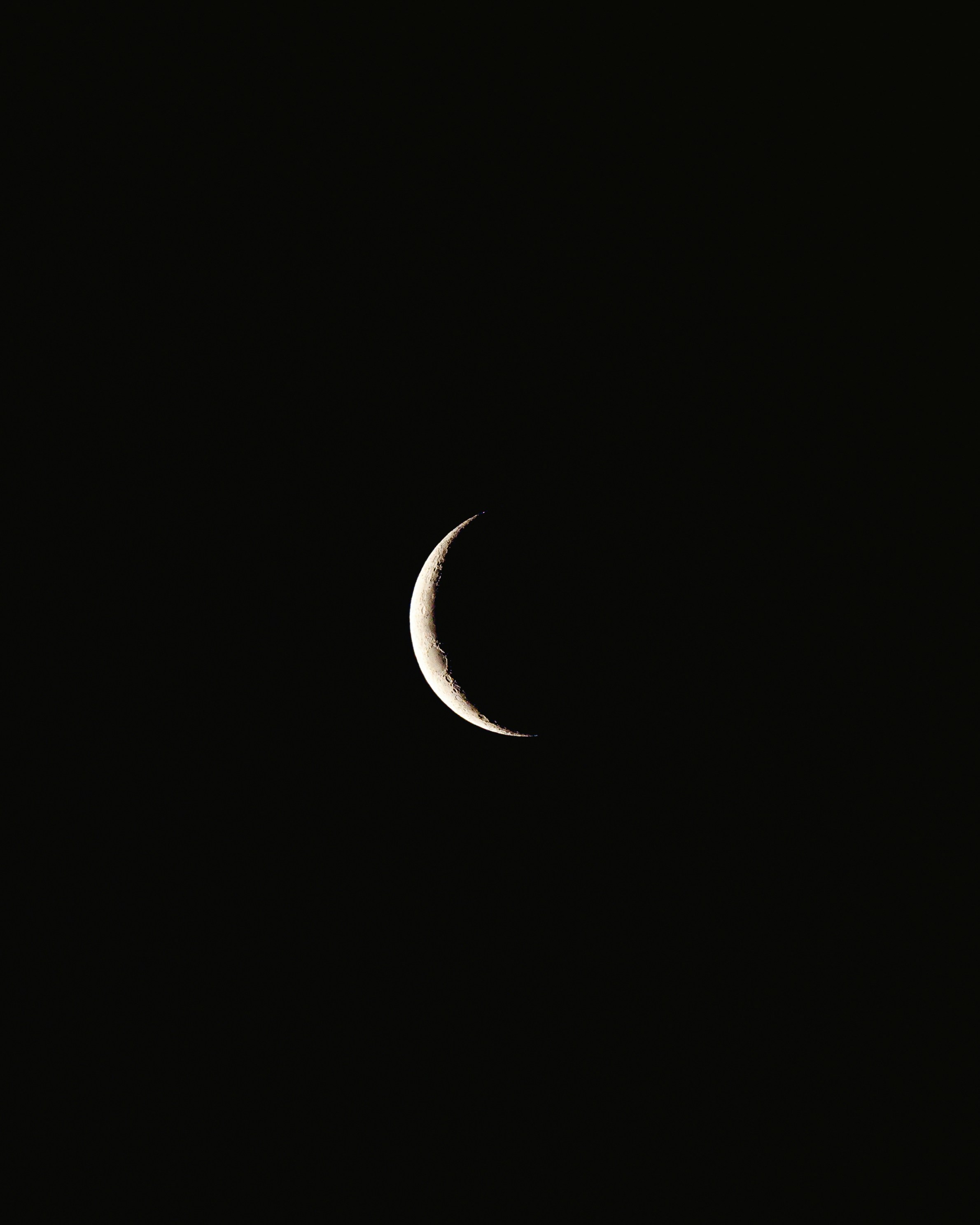 Crescent Moon In Dark Night Sky