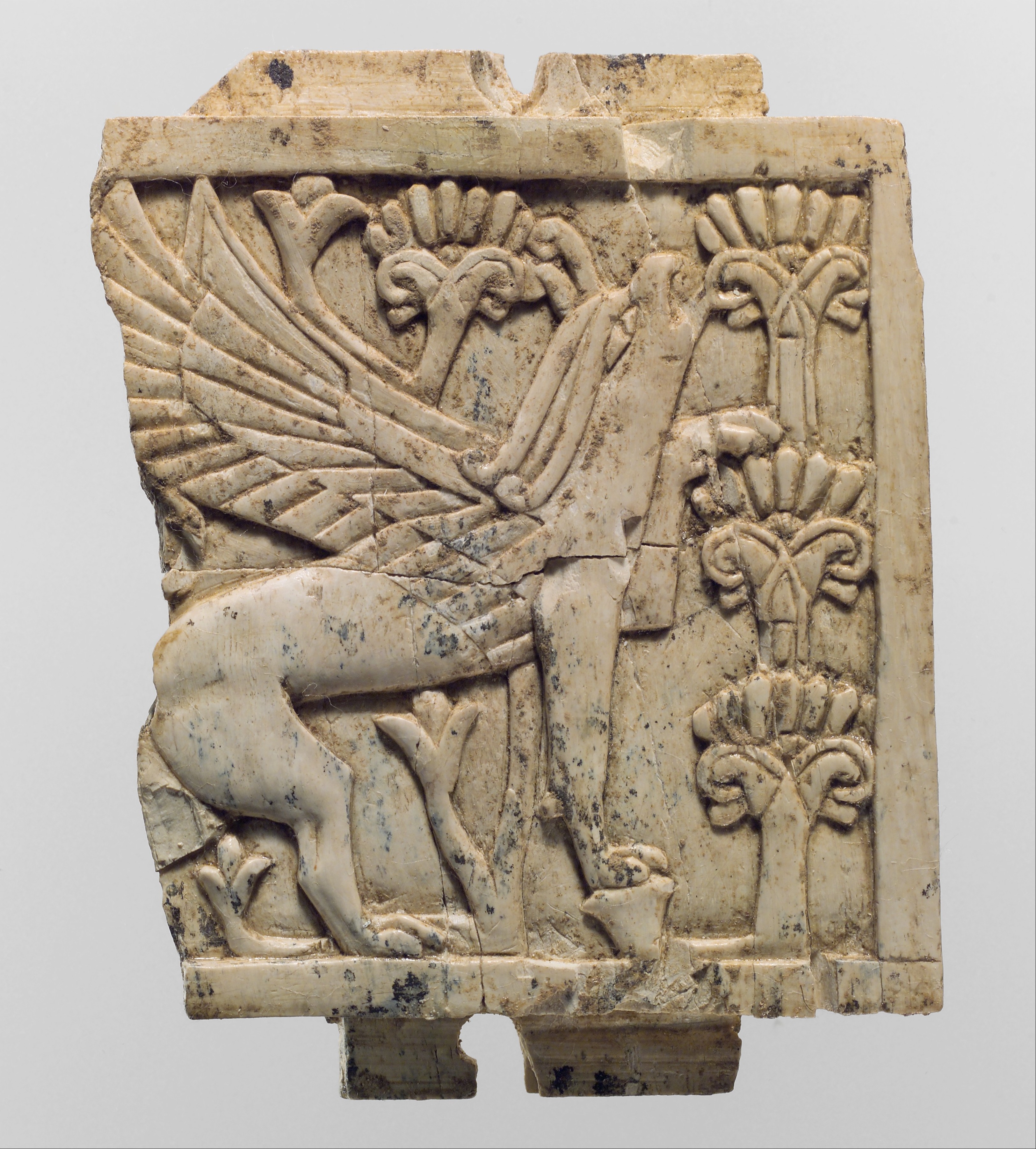 Ancient Carved Ivory Plaque with Winged Beast