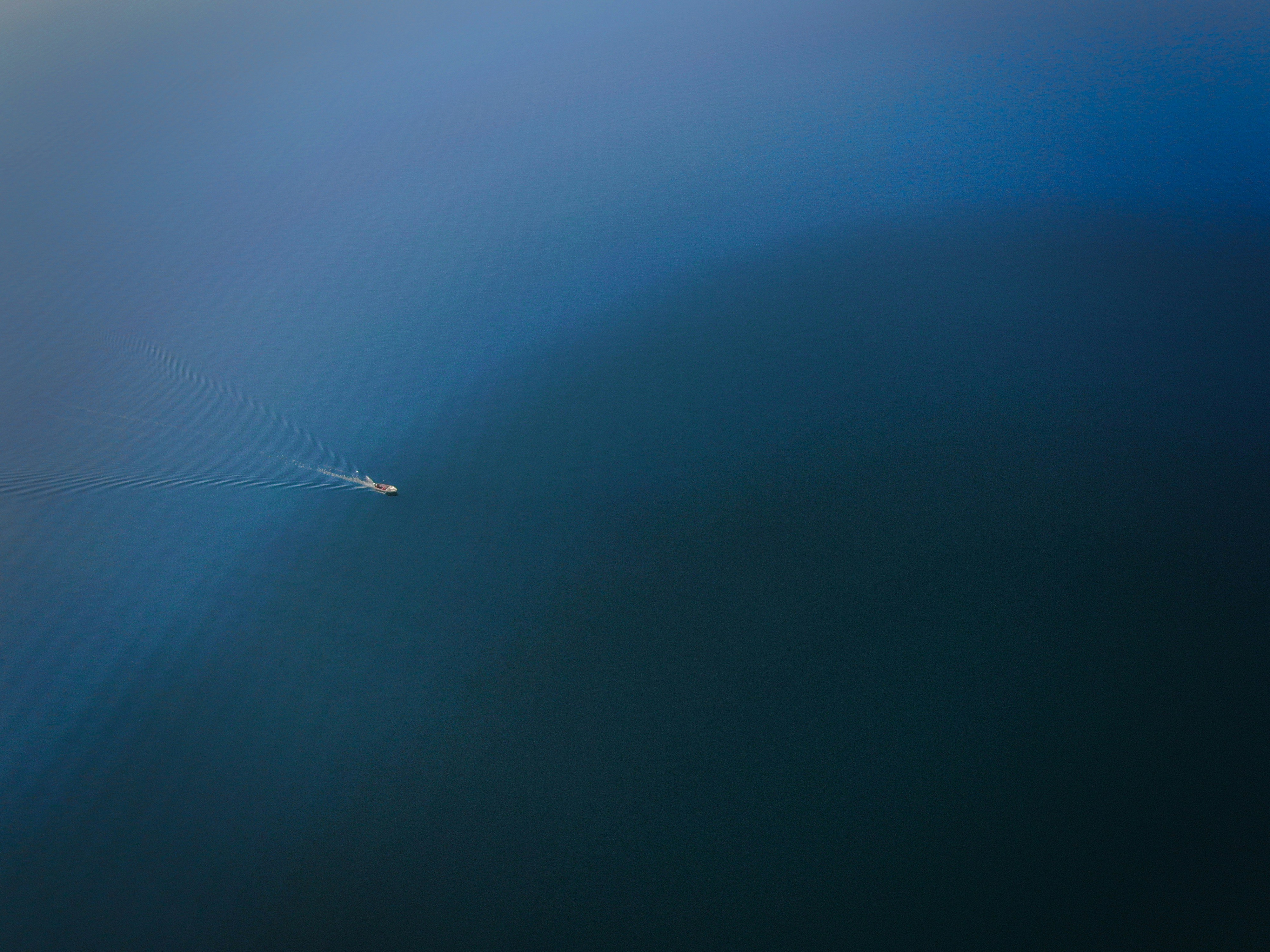 Small Boat on Calm Blue Water