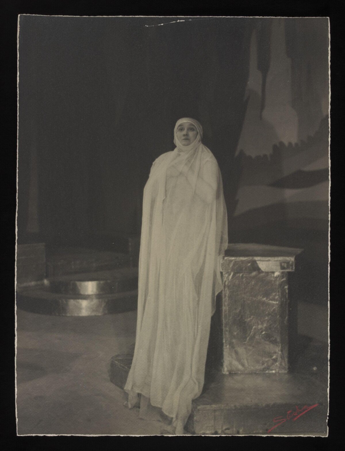 Actress in White Robe Stage Performance