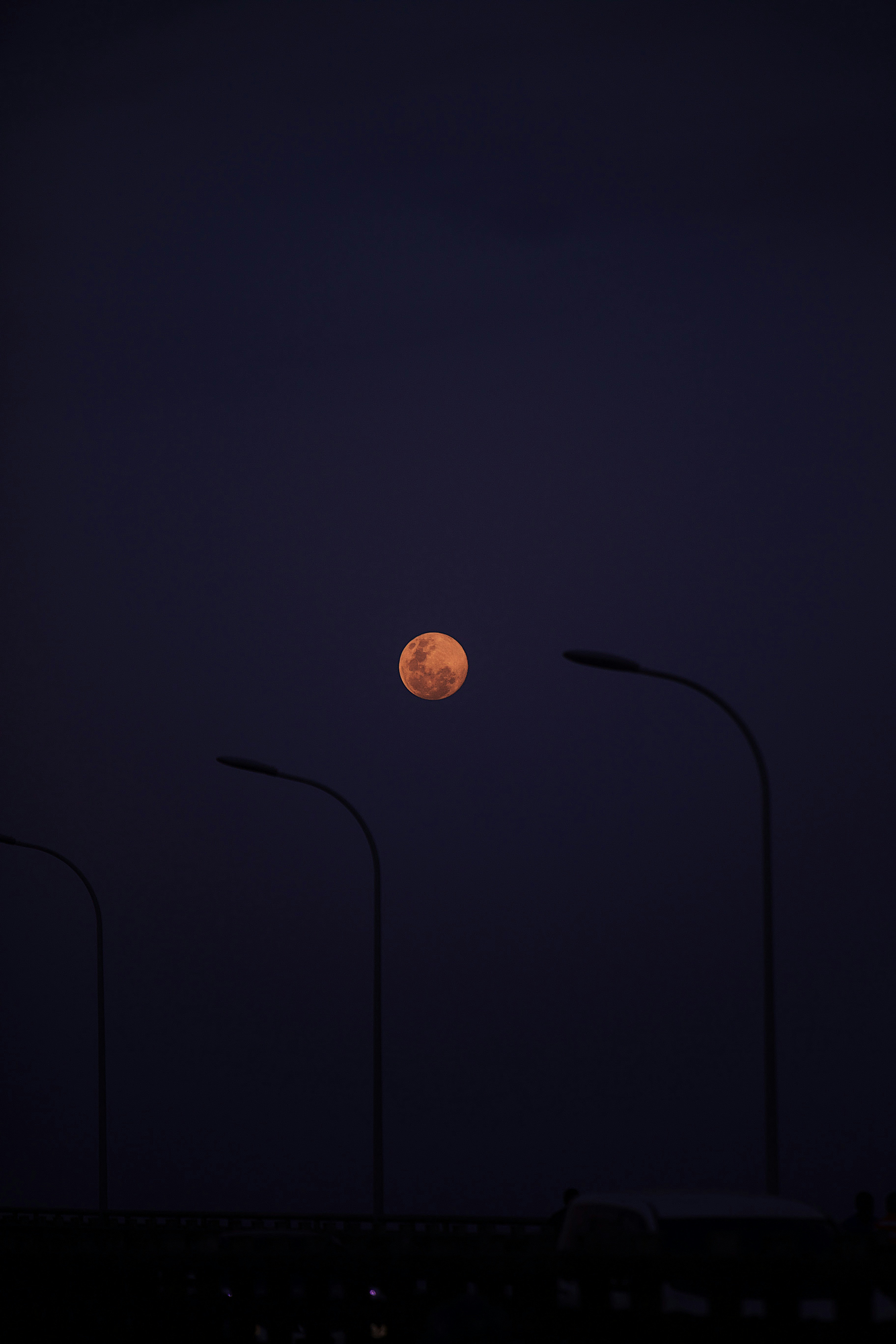 Orange Full Moon Over Night Street