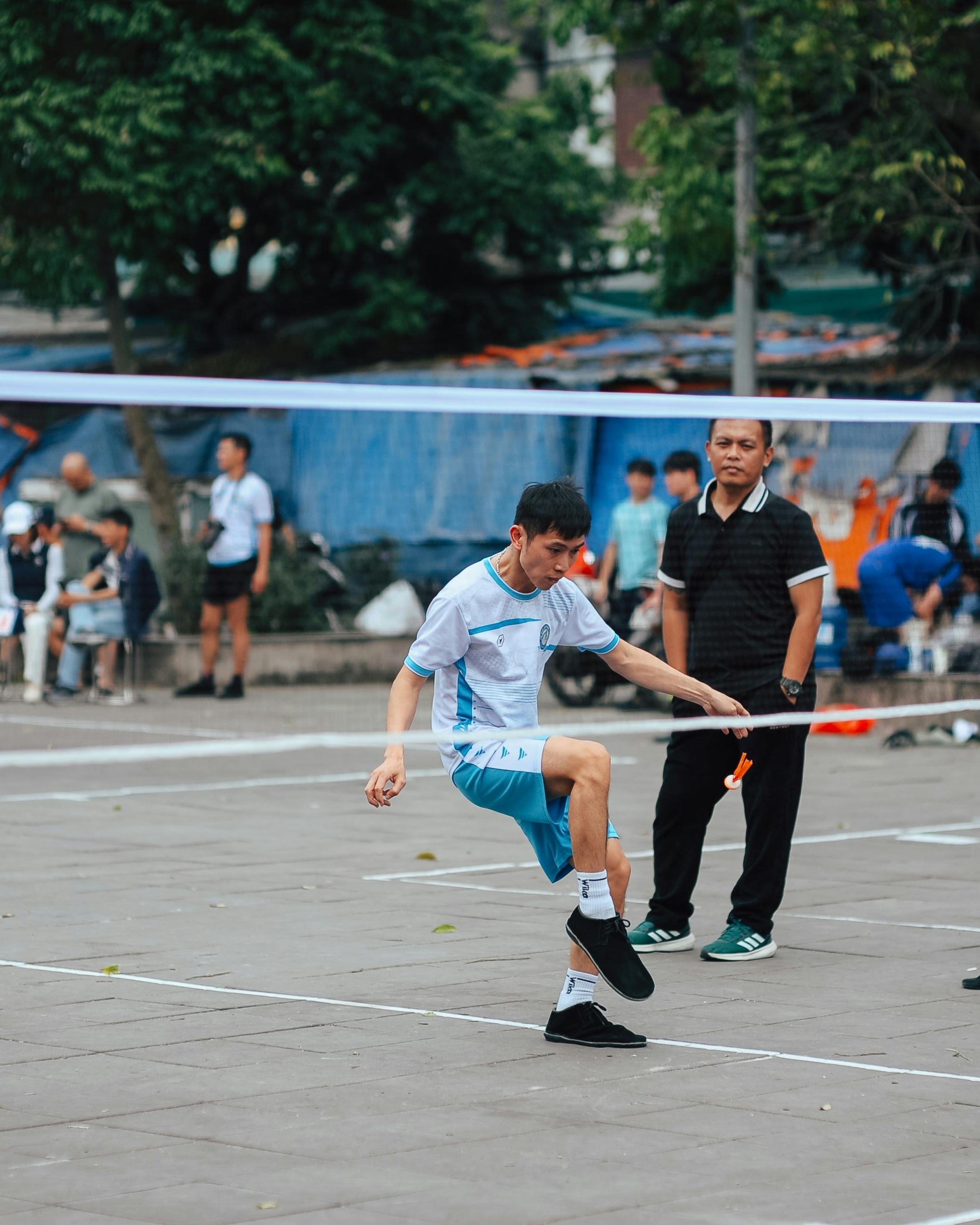 Man Playing Sepak Takraw Outdoors