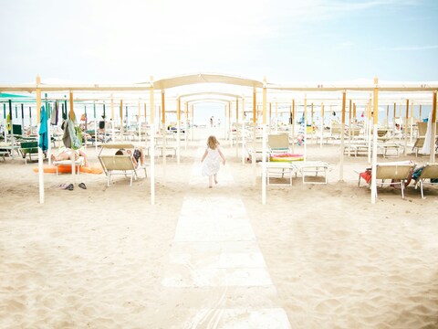 Little Girl Walking Towards Sea
