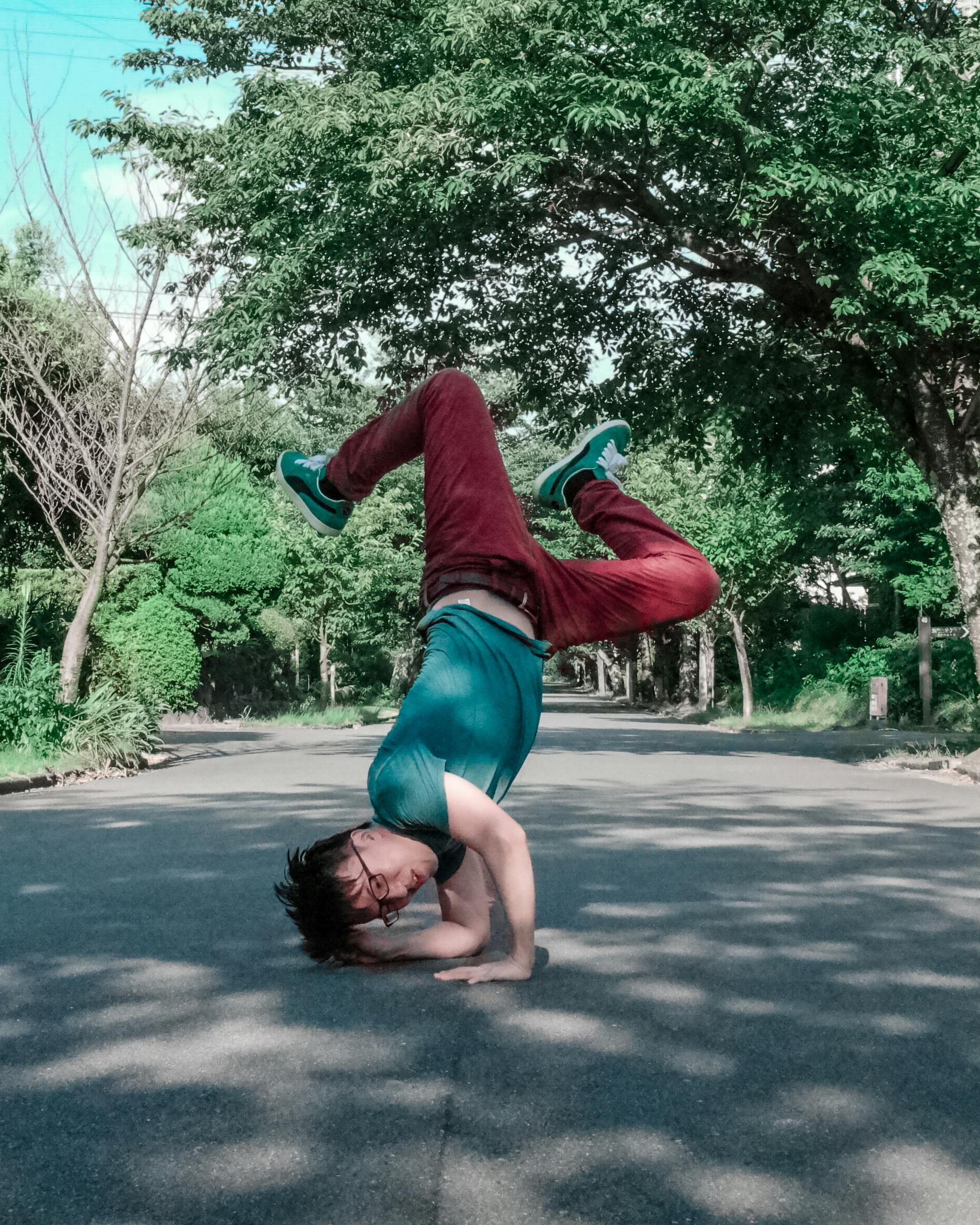 Breakdancer Holding Breakdance Freeze on Road