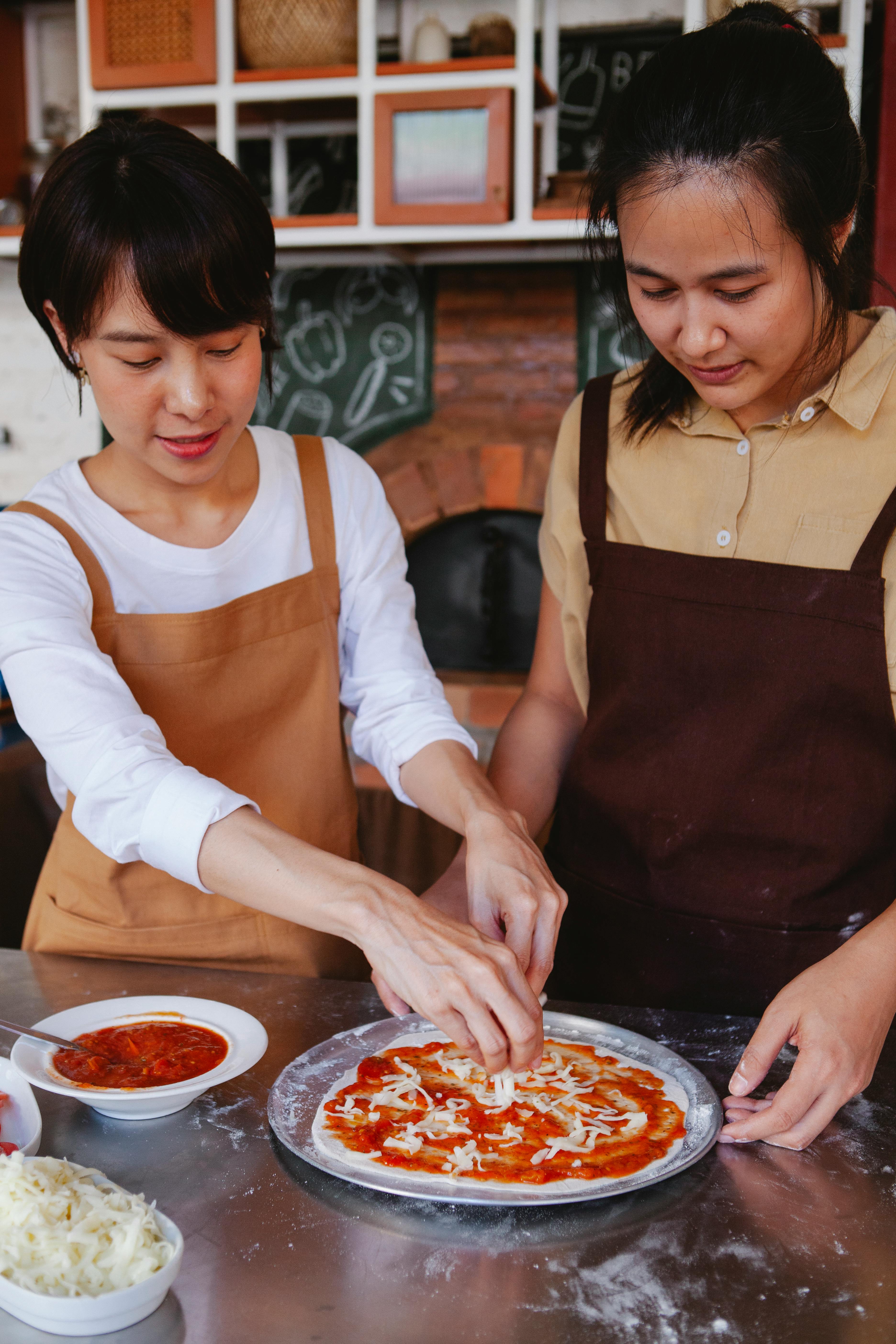 Two Women Making Homemade Pizza