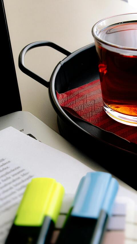 Desk Workspace with Tea and Highlighters