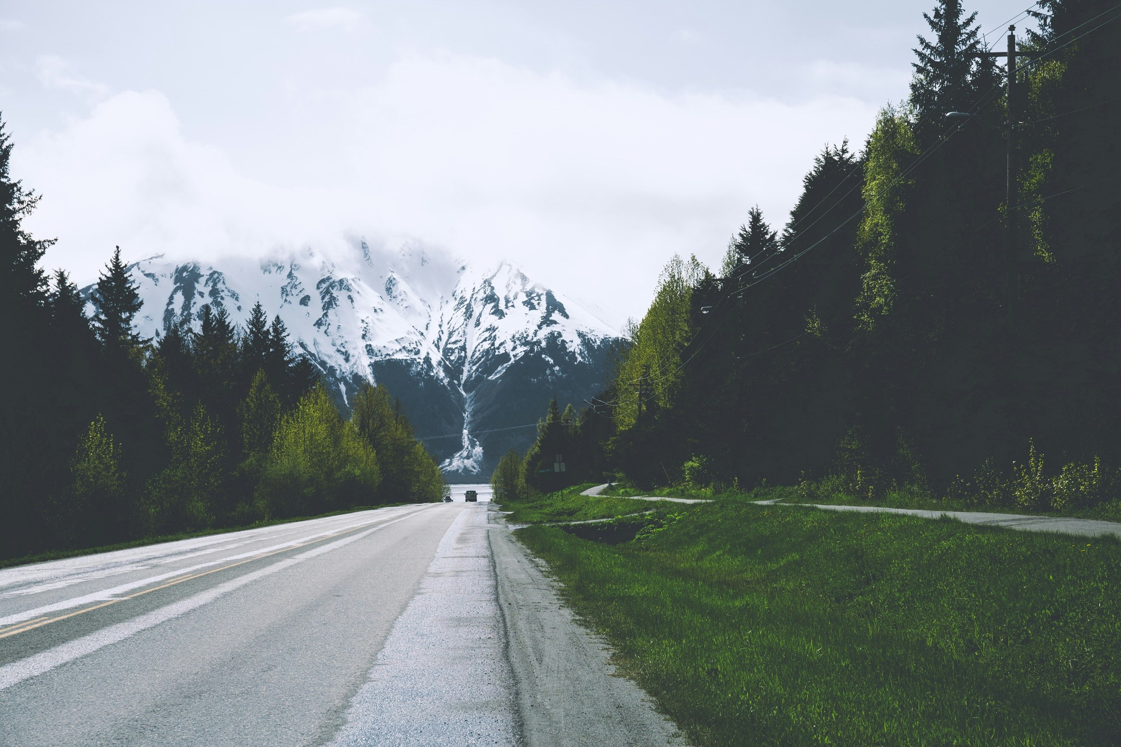 Road Leading to Snow-capped Mountains