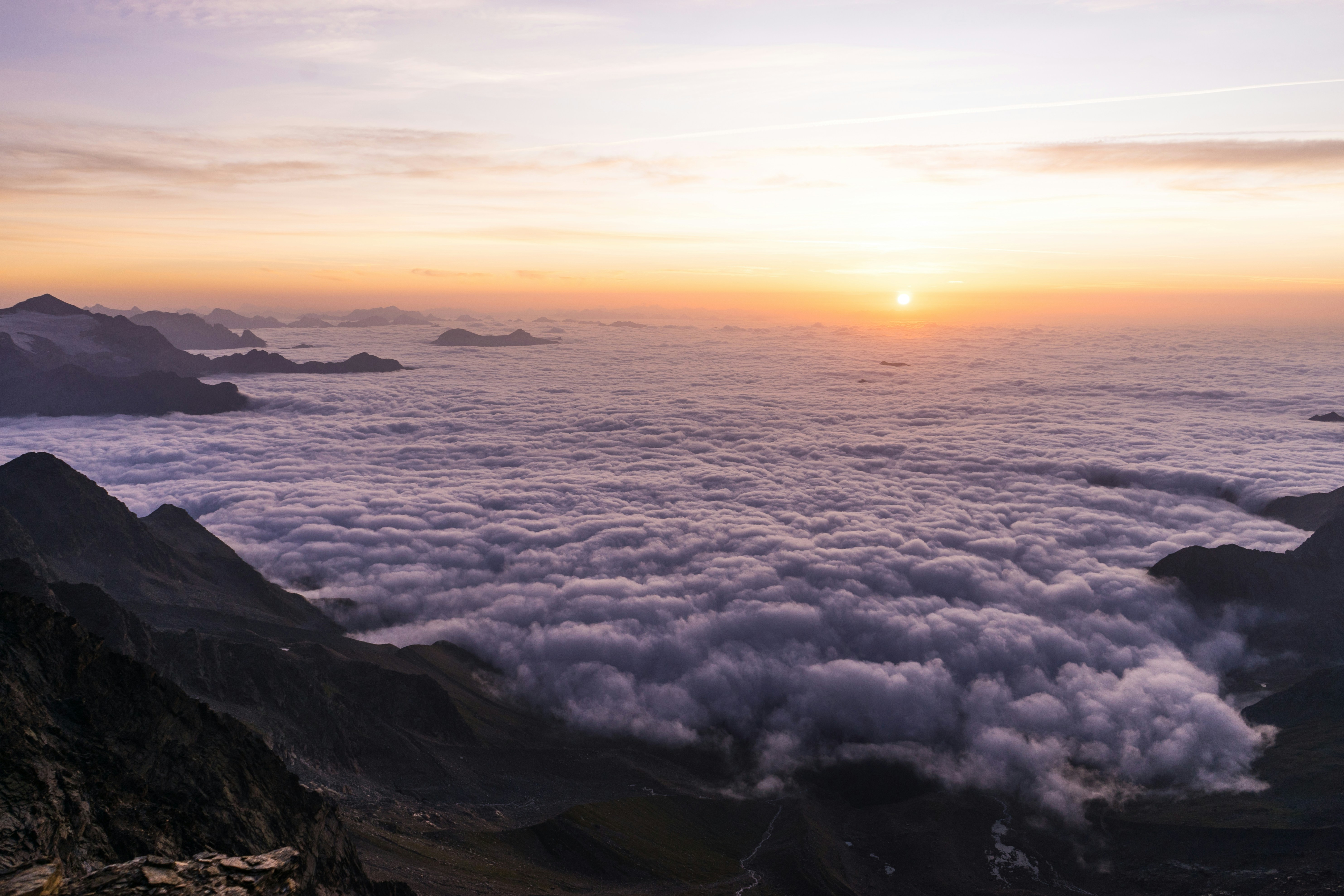 Mountain Sunrise Above Sea of Clouds