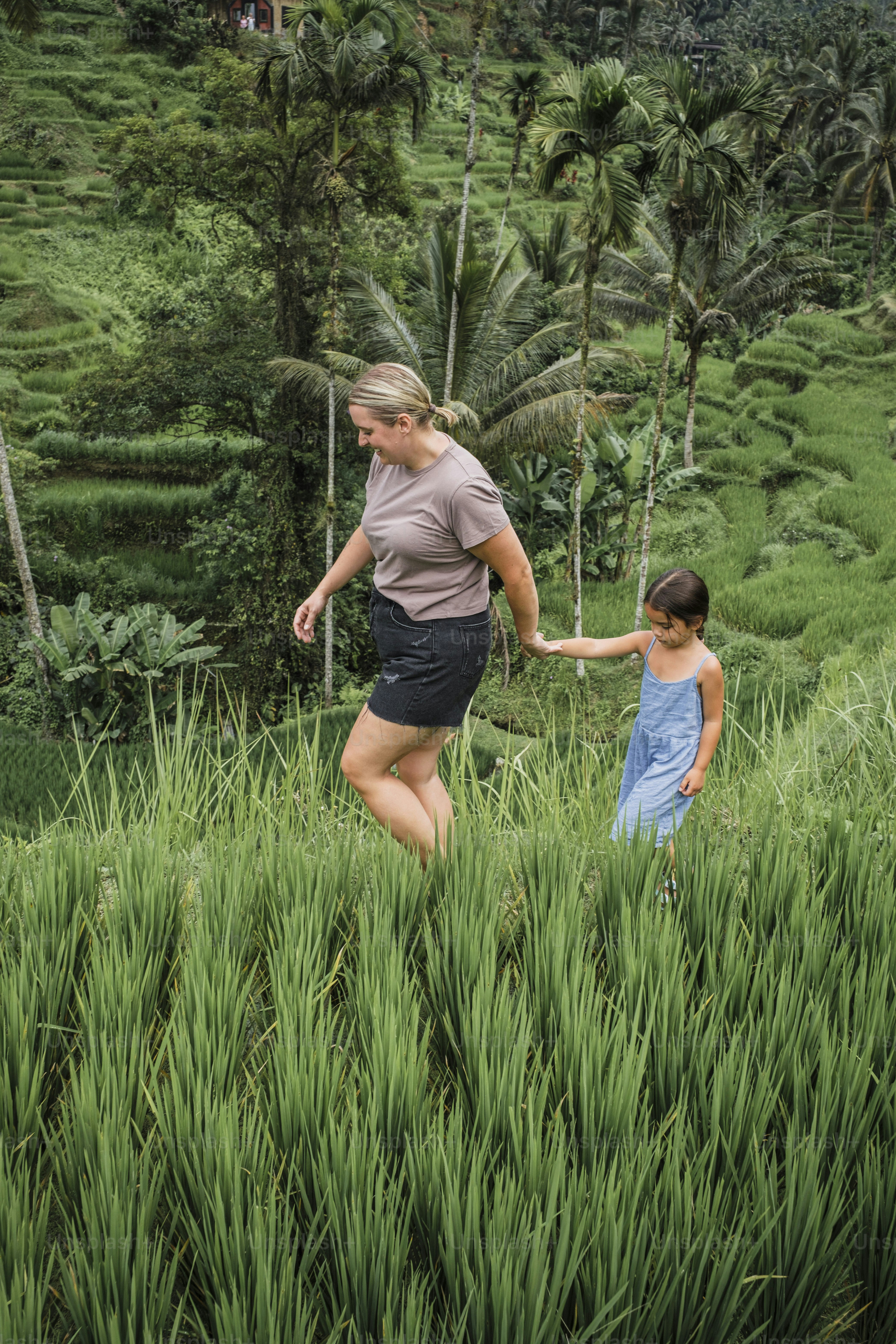 Mother and Daughter Walking in Rice Terraces