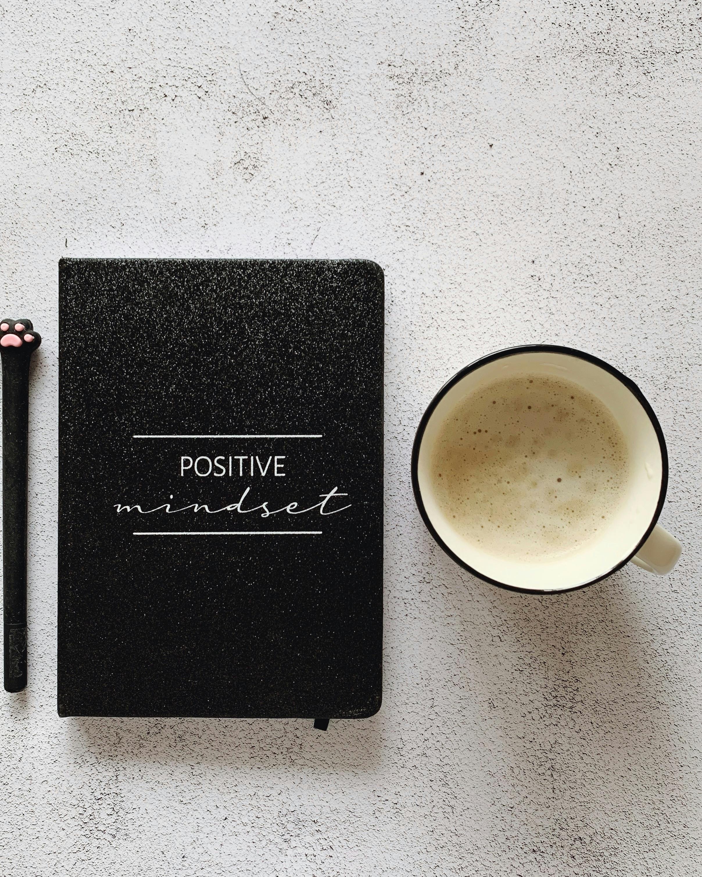 Positive Mindset Notebook and Coffee Flat Lay