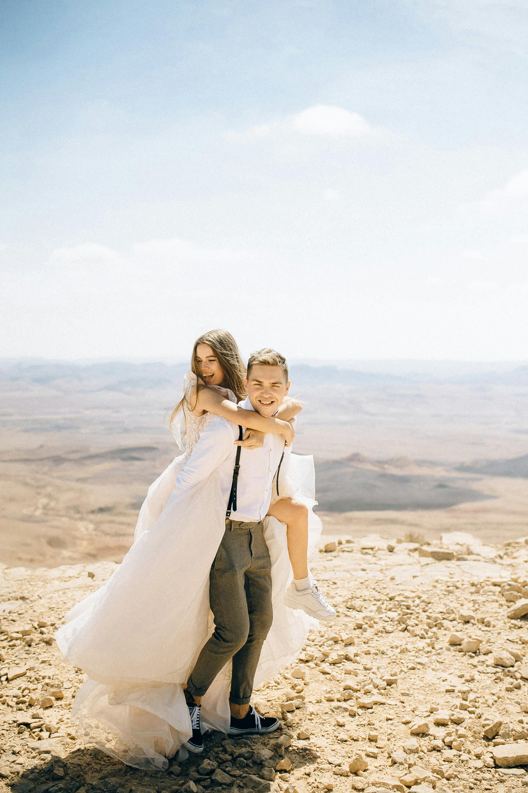 Wedding Couple Piggyback in Desert
