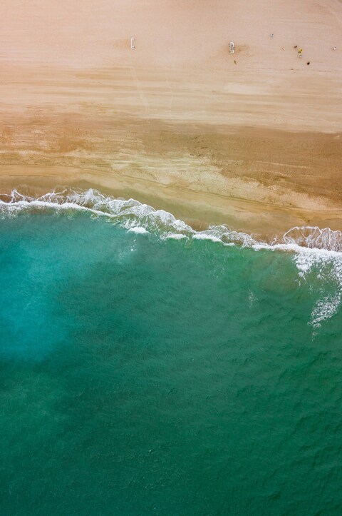 Aerial View of Sandy Beach and Sea