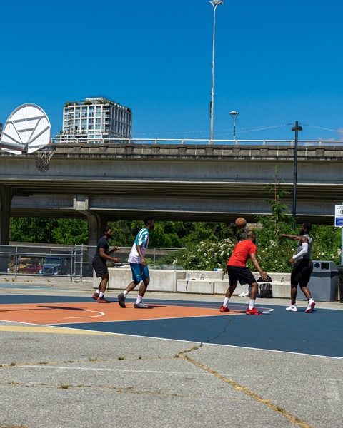 Four Men Playing Outdoor Basketball