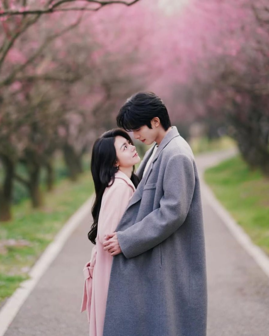 Couple Embracing Among Cherry Blossoms