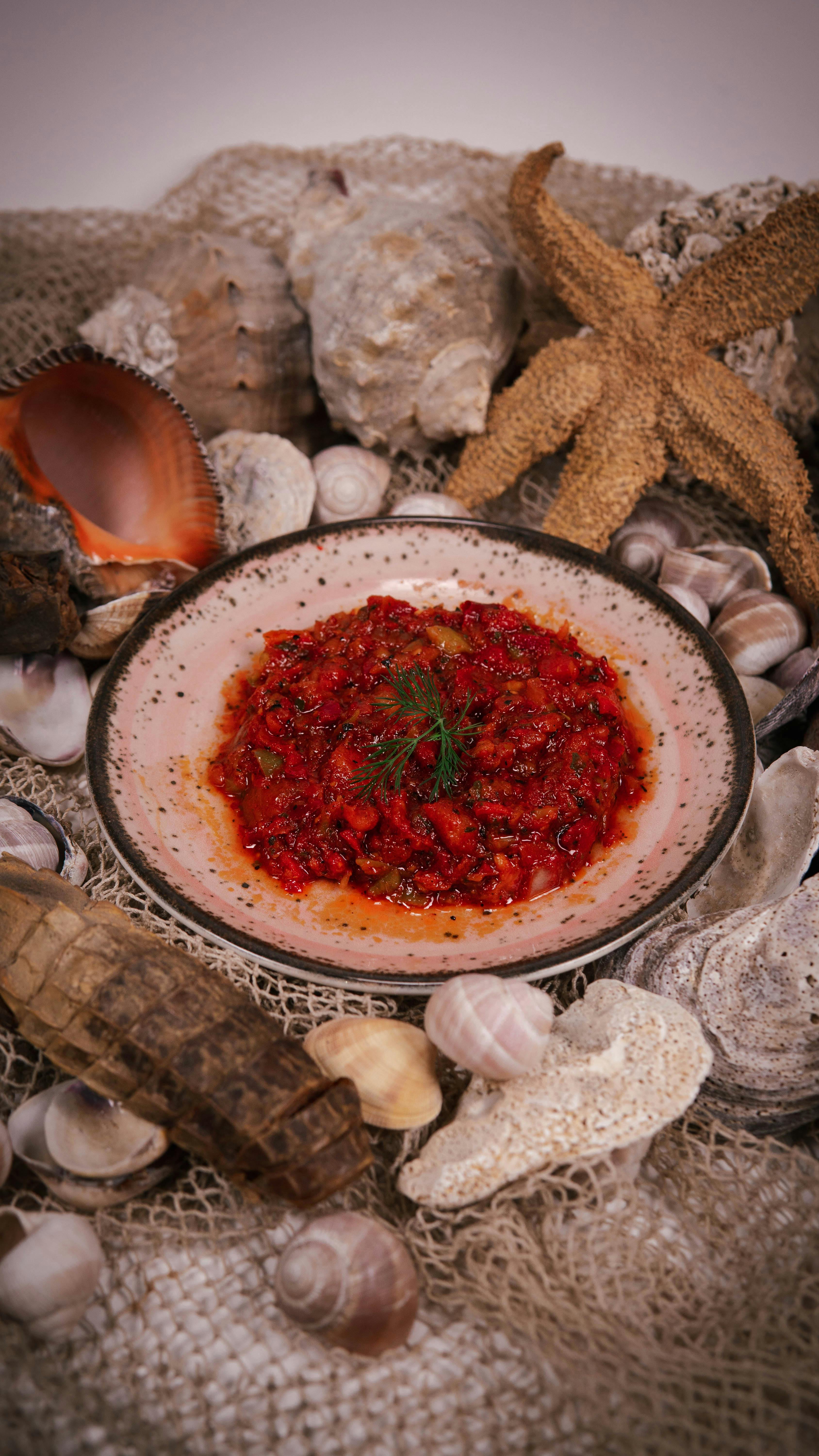 Red Seafood Sauce on Nautical Seashell Setting