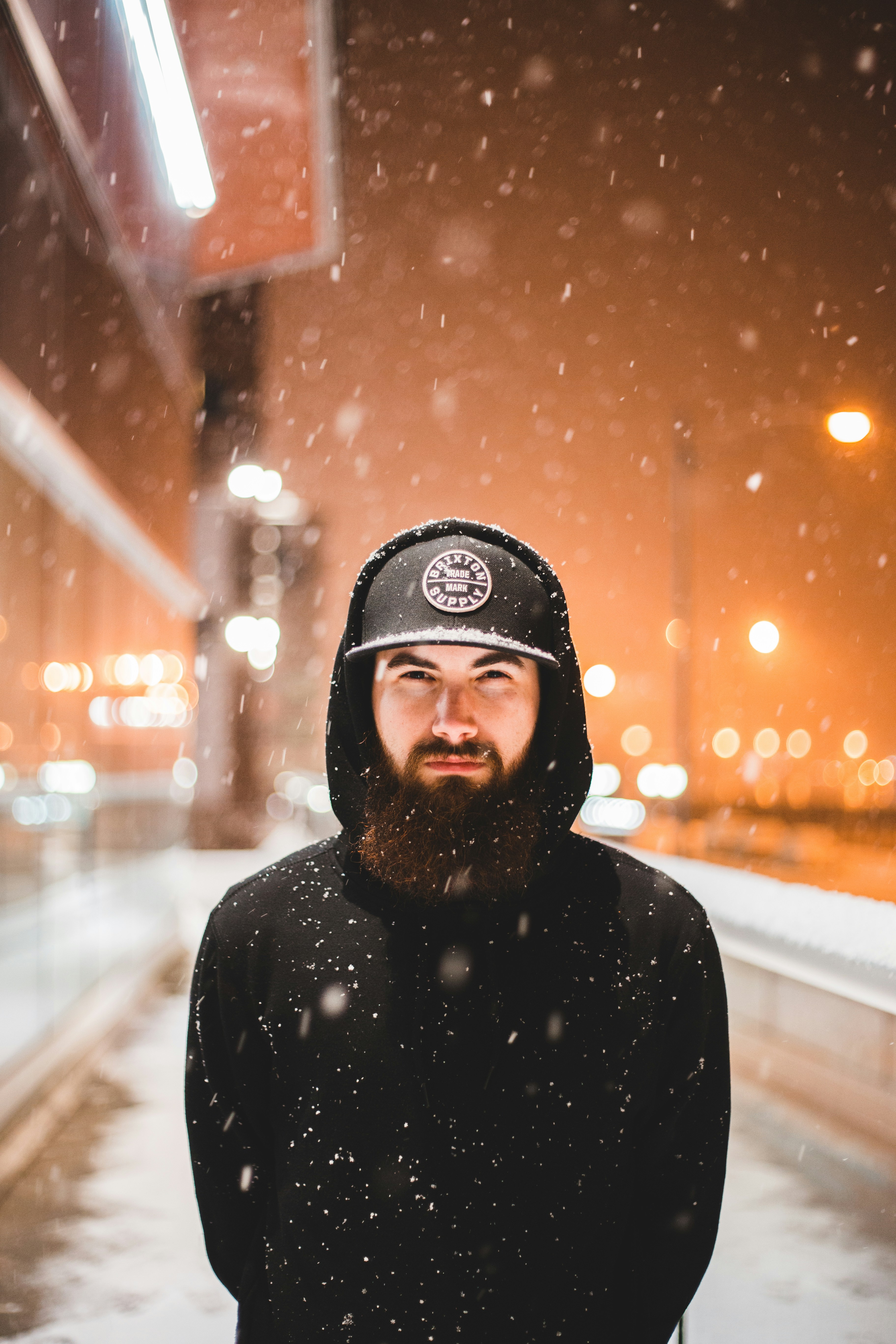 Bearded Man on Snowy Night Street