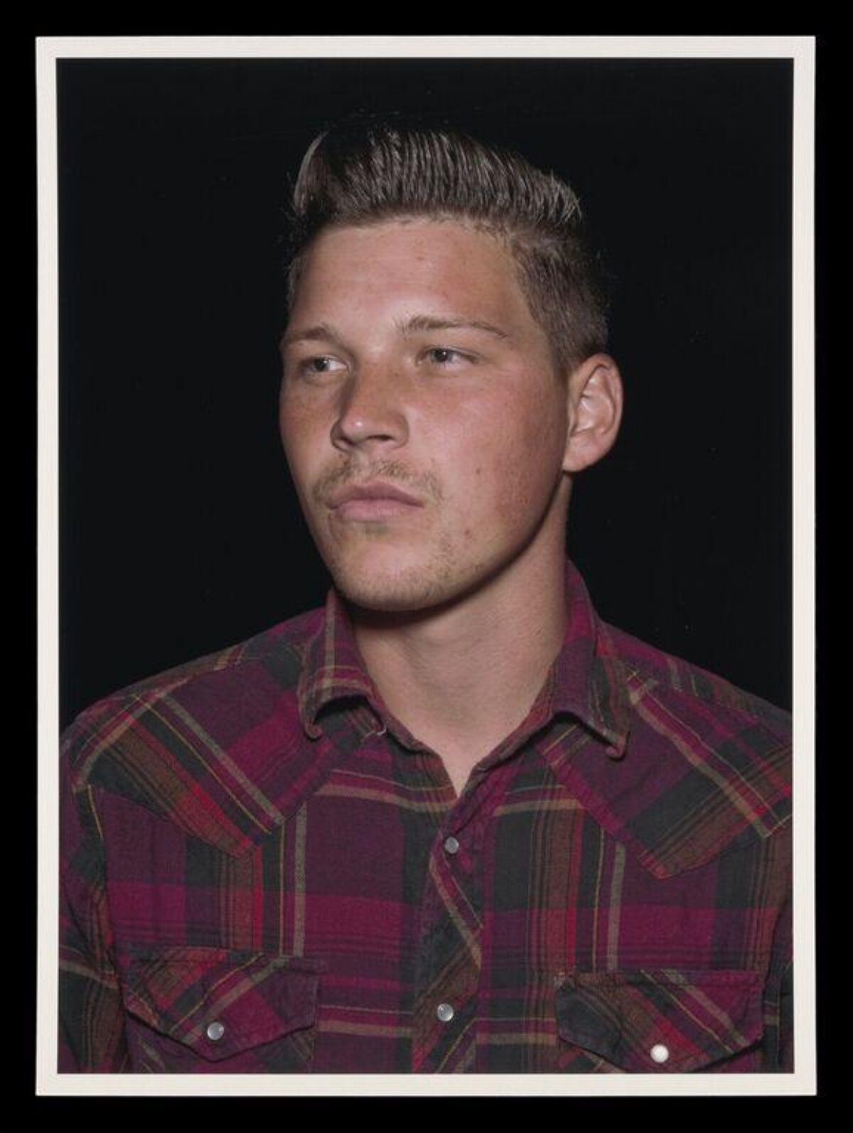 Bust Portrait of Man in Plaid Shirt